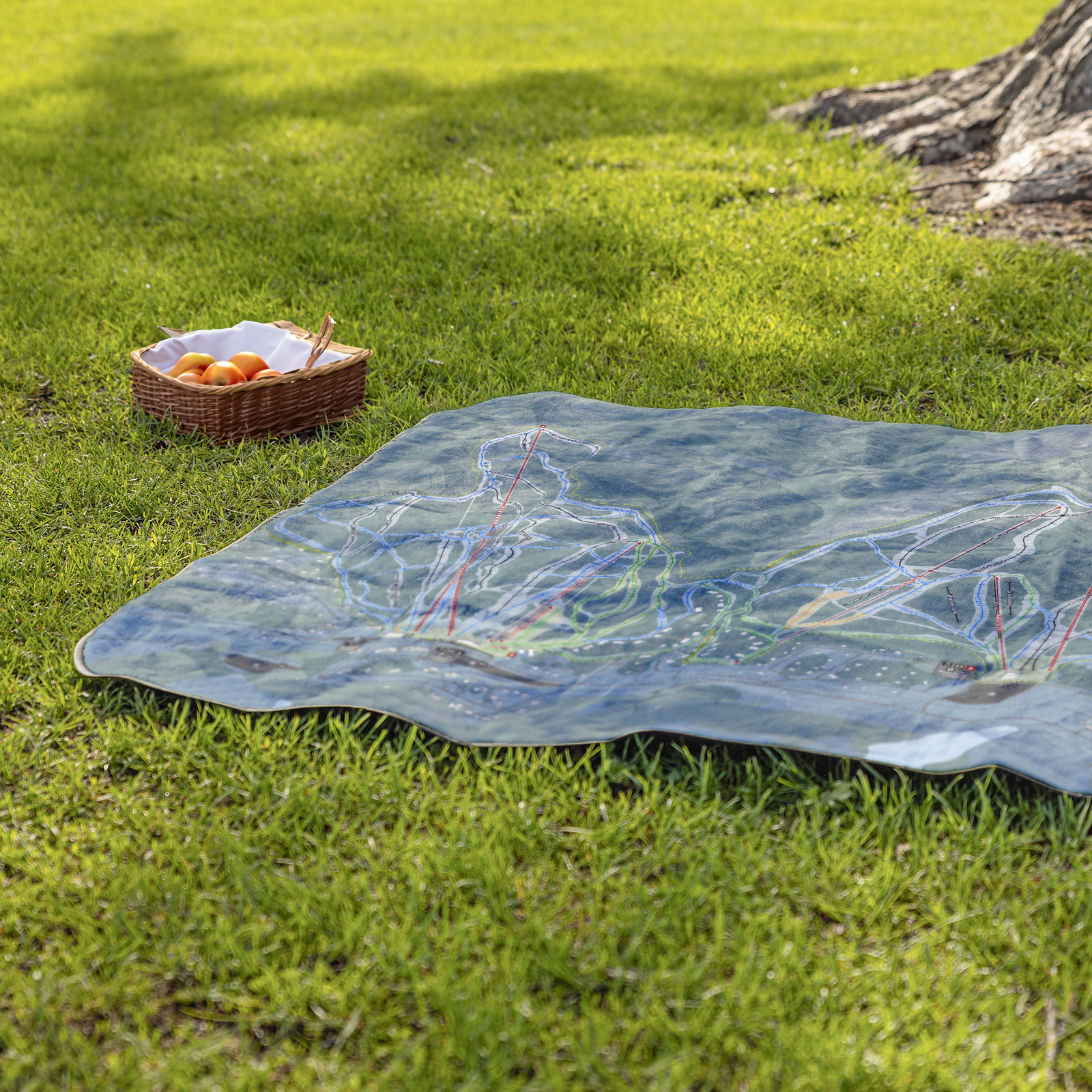 AttitashMountain_StadiumBlanket_Lifestyle_Grass_V_AS_Mockup.png