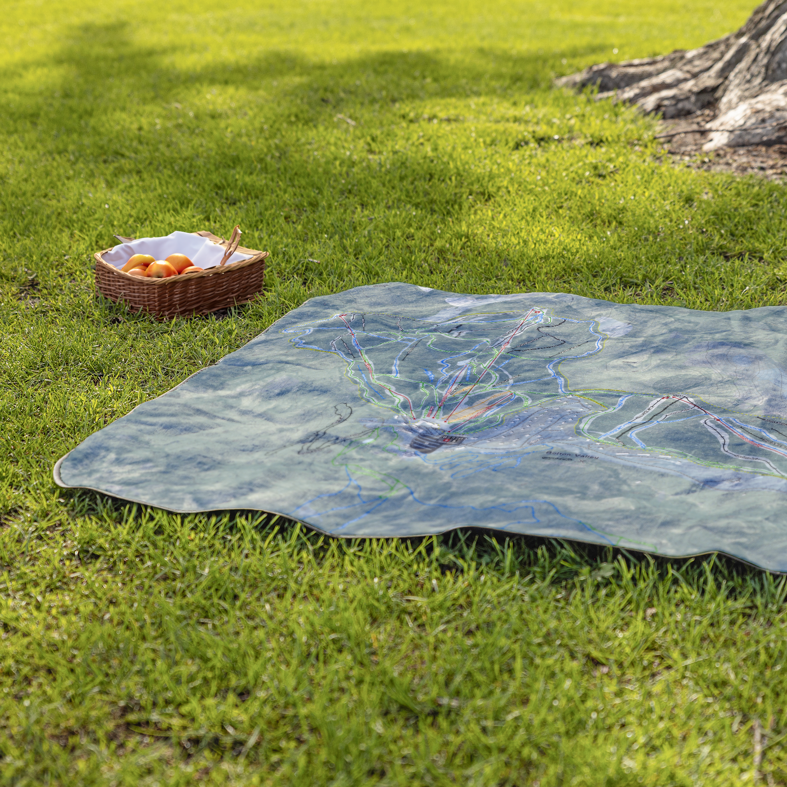 BoltonValley_StadiumBlanket_Lifestyle_Grass_V_AS_Mockup.png