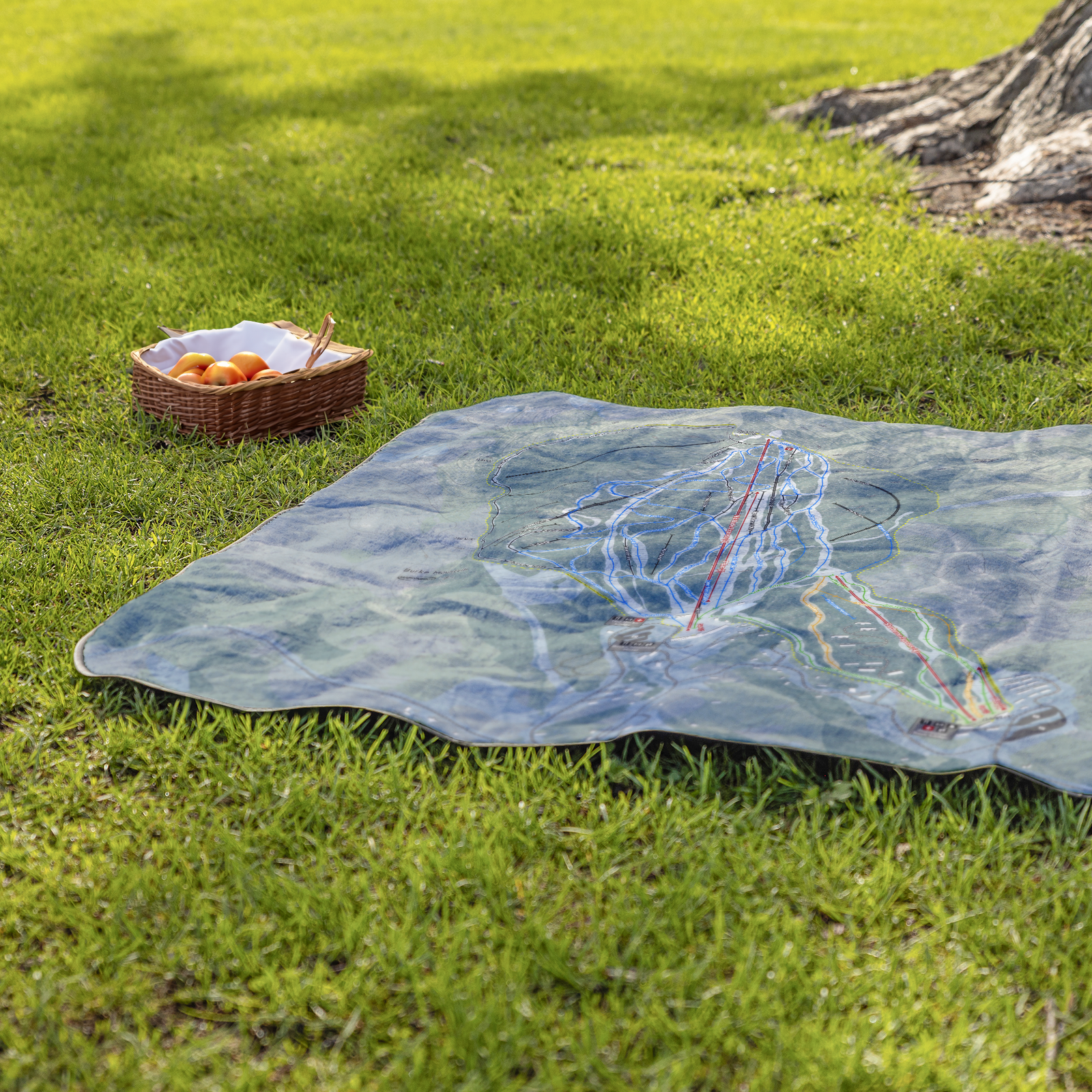 Burke_Mountain_StadiumBlanket_Lifestyle_Grass_V_AS_Mockup.png