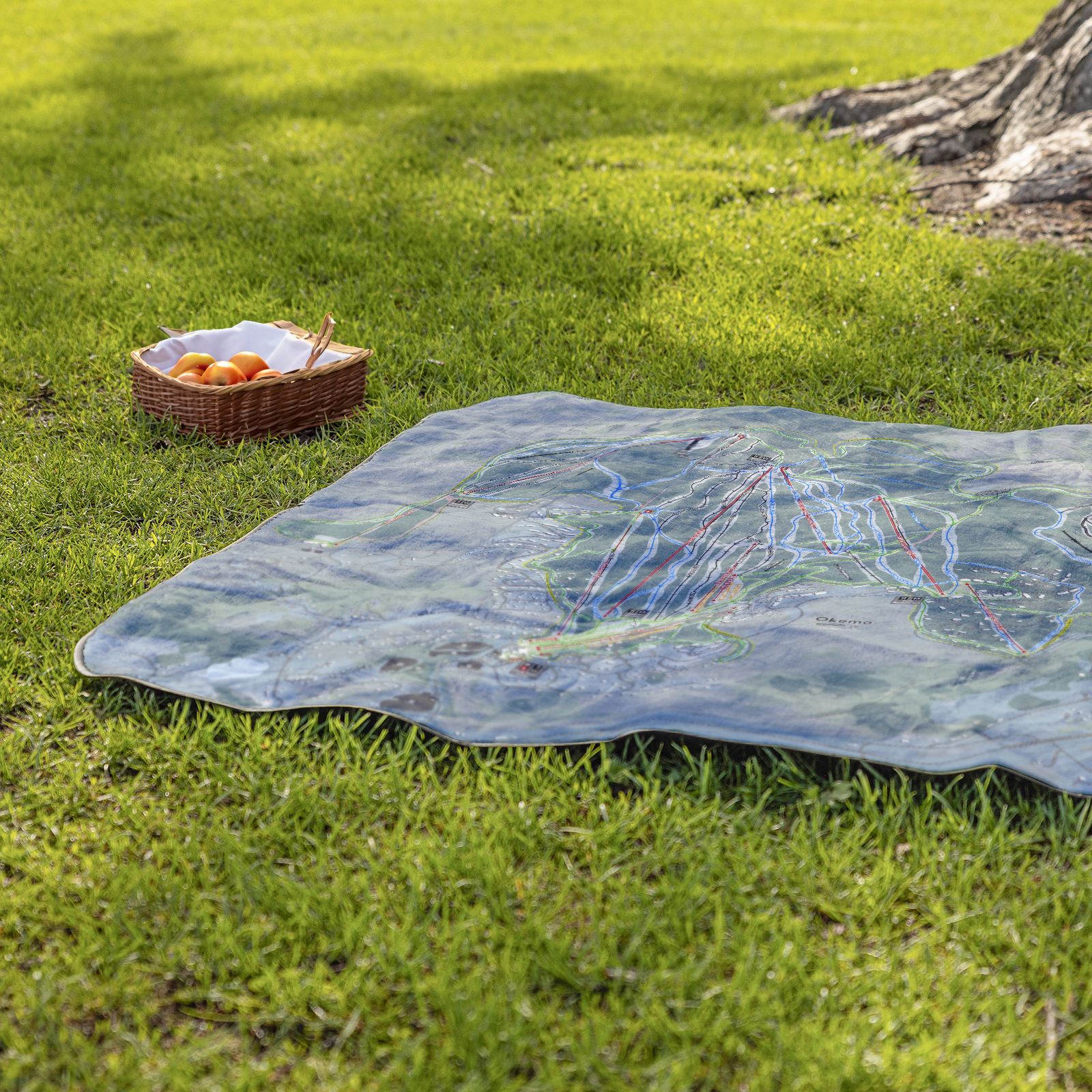 Okemo_Mountain_StadiumBlanket_Lifestyle_Grass_V_AS_Mockup.png