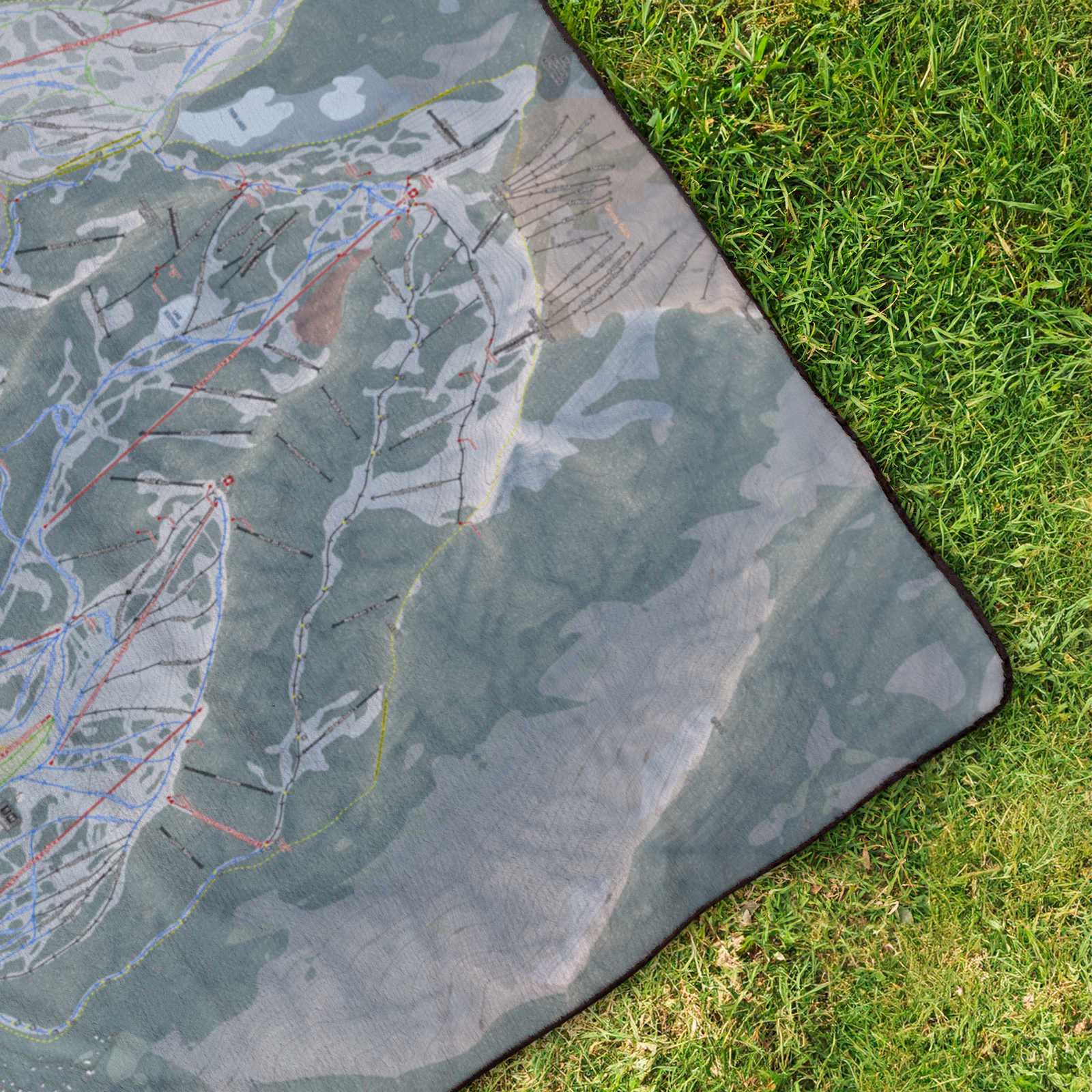 Solitude_StadiumBlanket_OverheadGrass_V_Mockup.png