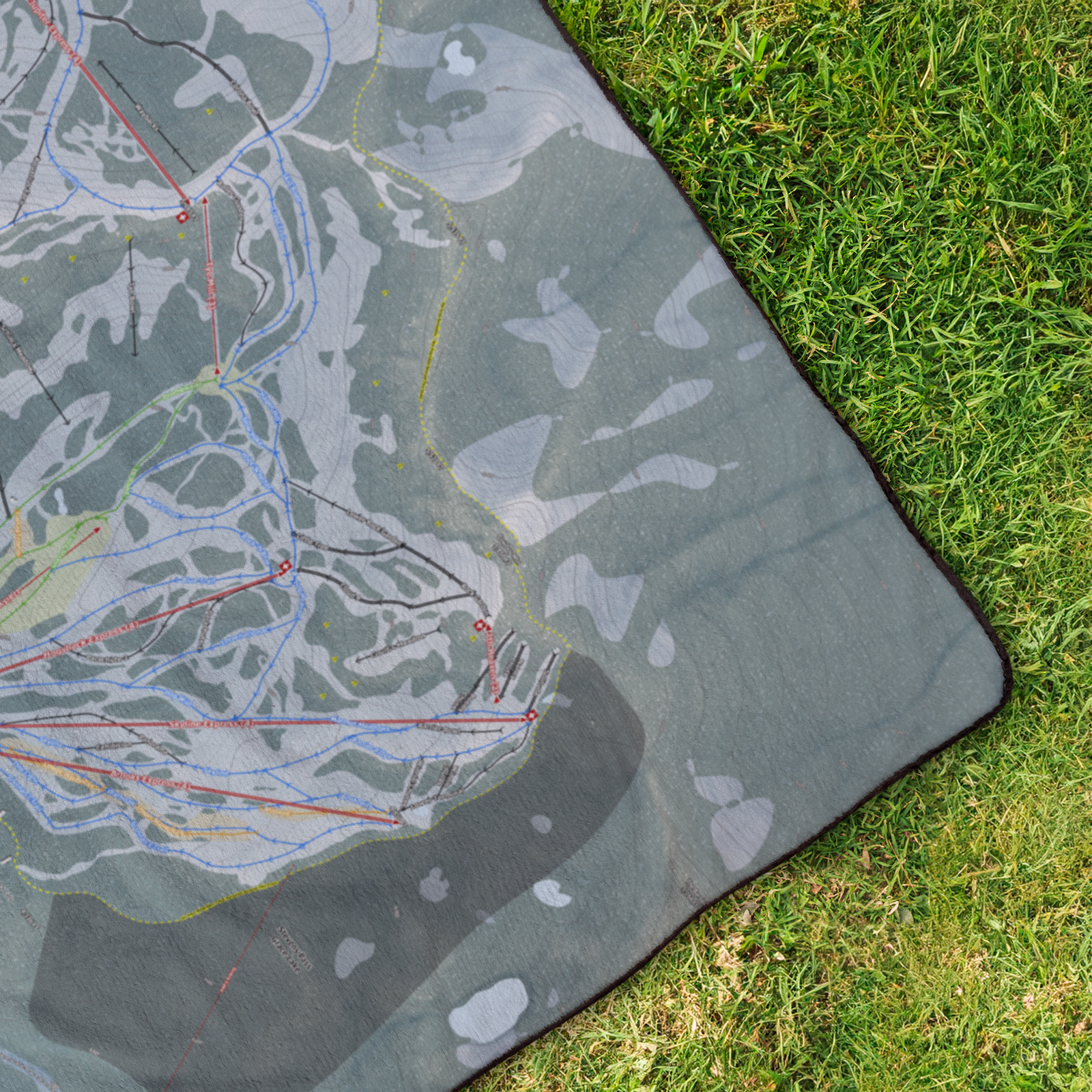 Stevens_Pass_StadiumBlanket_OverheadGrass_V_Mockup.png