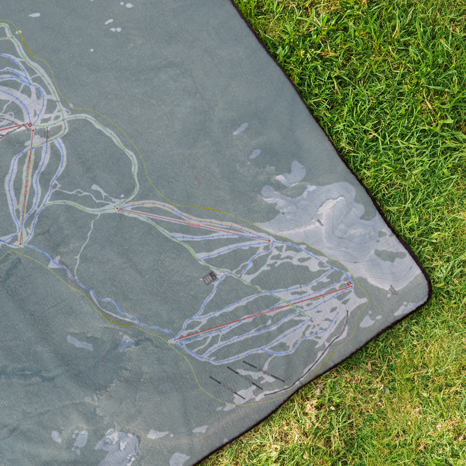 White_Pass_StadiumBlanket_OverheadGrass_V_Mockup.png