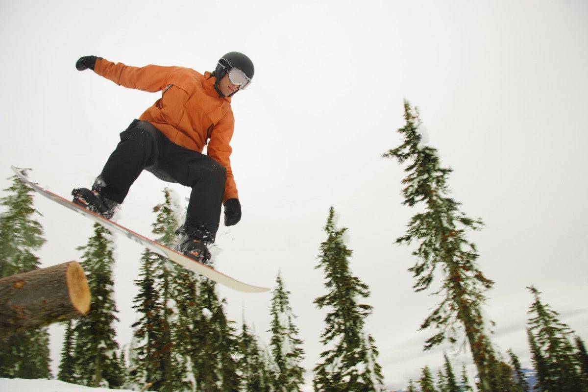 Snowboarder In Mid Air - Powderaddicts