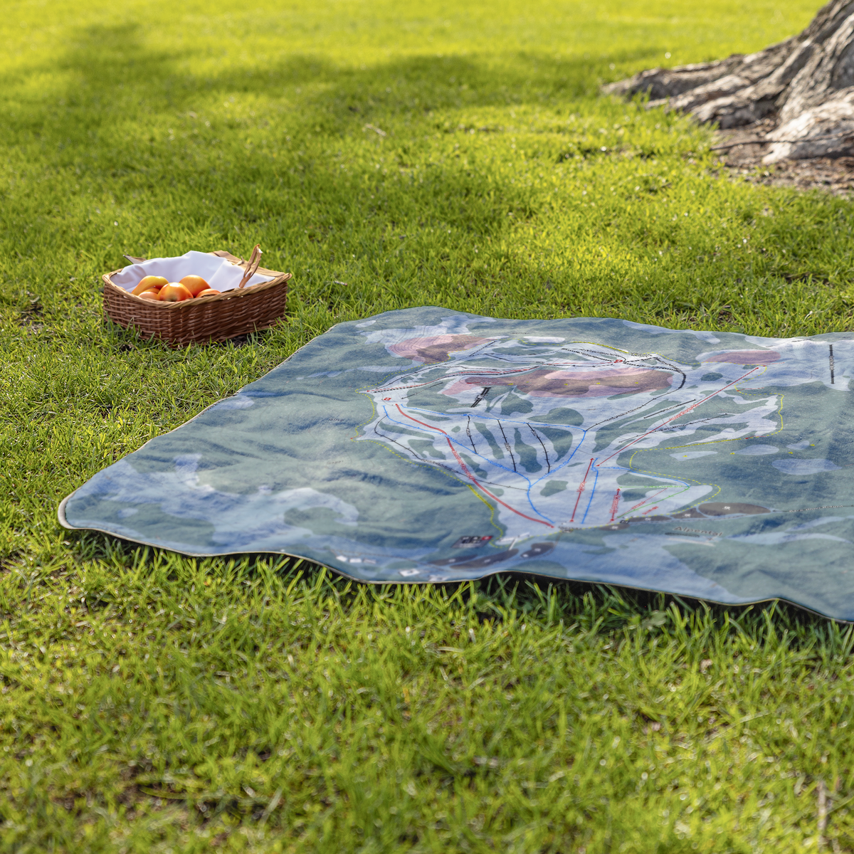 Alpental_StadiumBlanket_Lifestyle_Grass_V_AS_Mockup.png