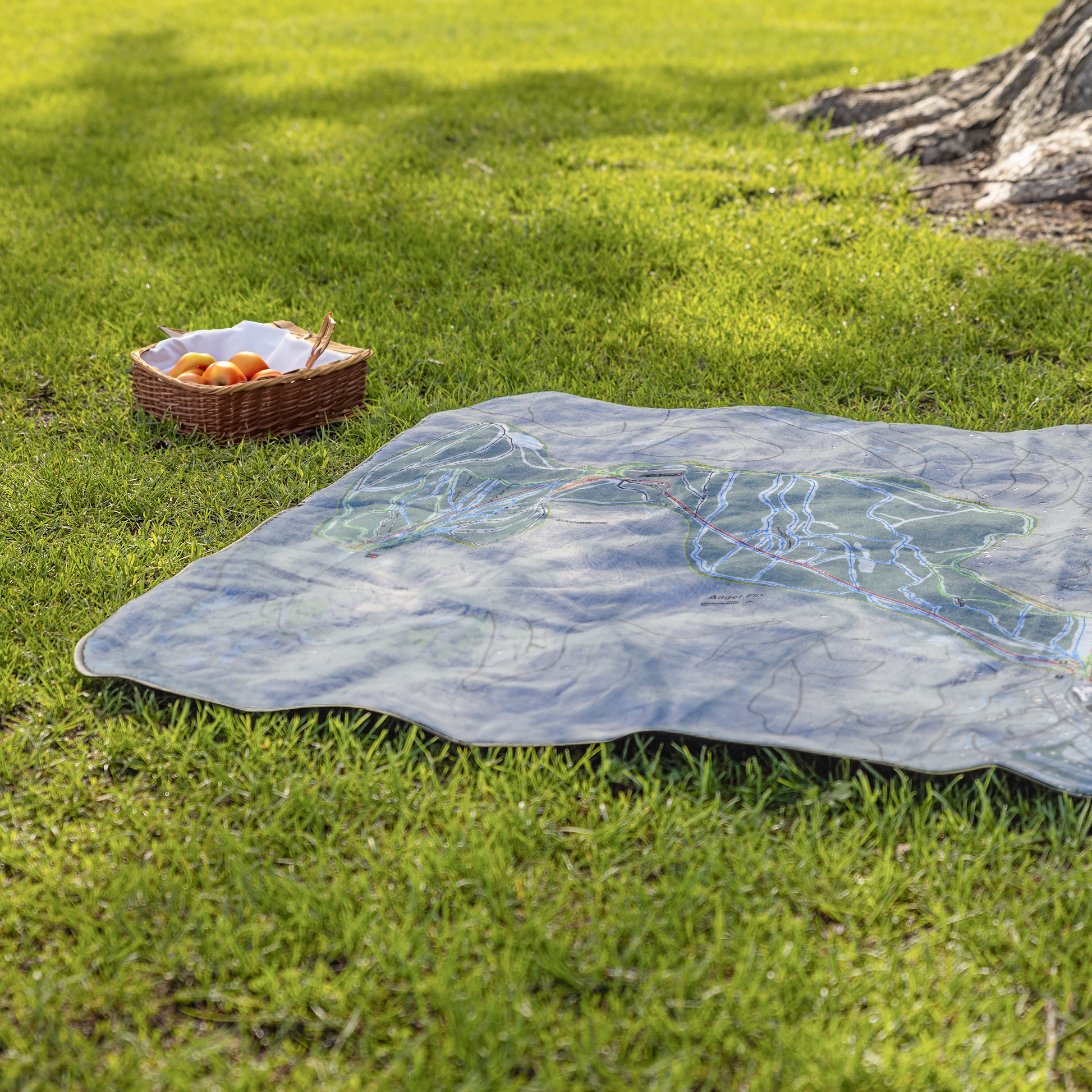 Angel_Fire_StadiumBlanket_Lifestyle_Grass_V_AS_Mockup.png
