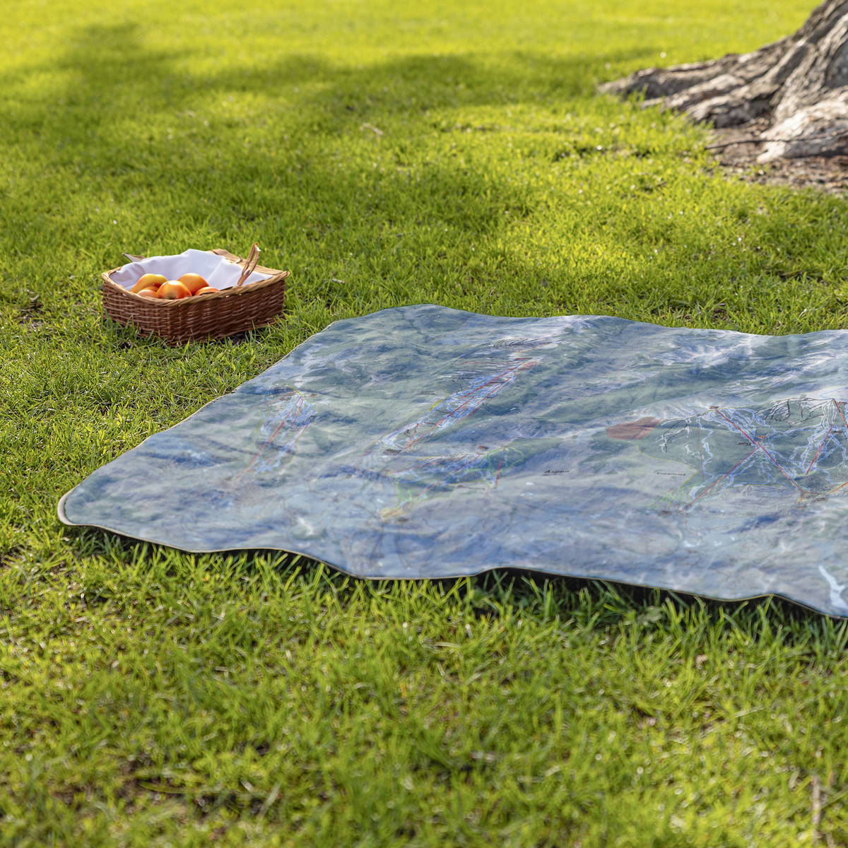 AspenSnowmass_StadiumBlanket_Lifestyle_Grass_V_AS_Mockup.png