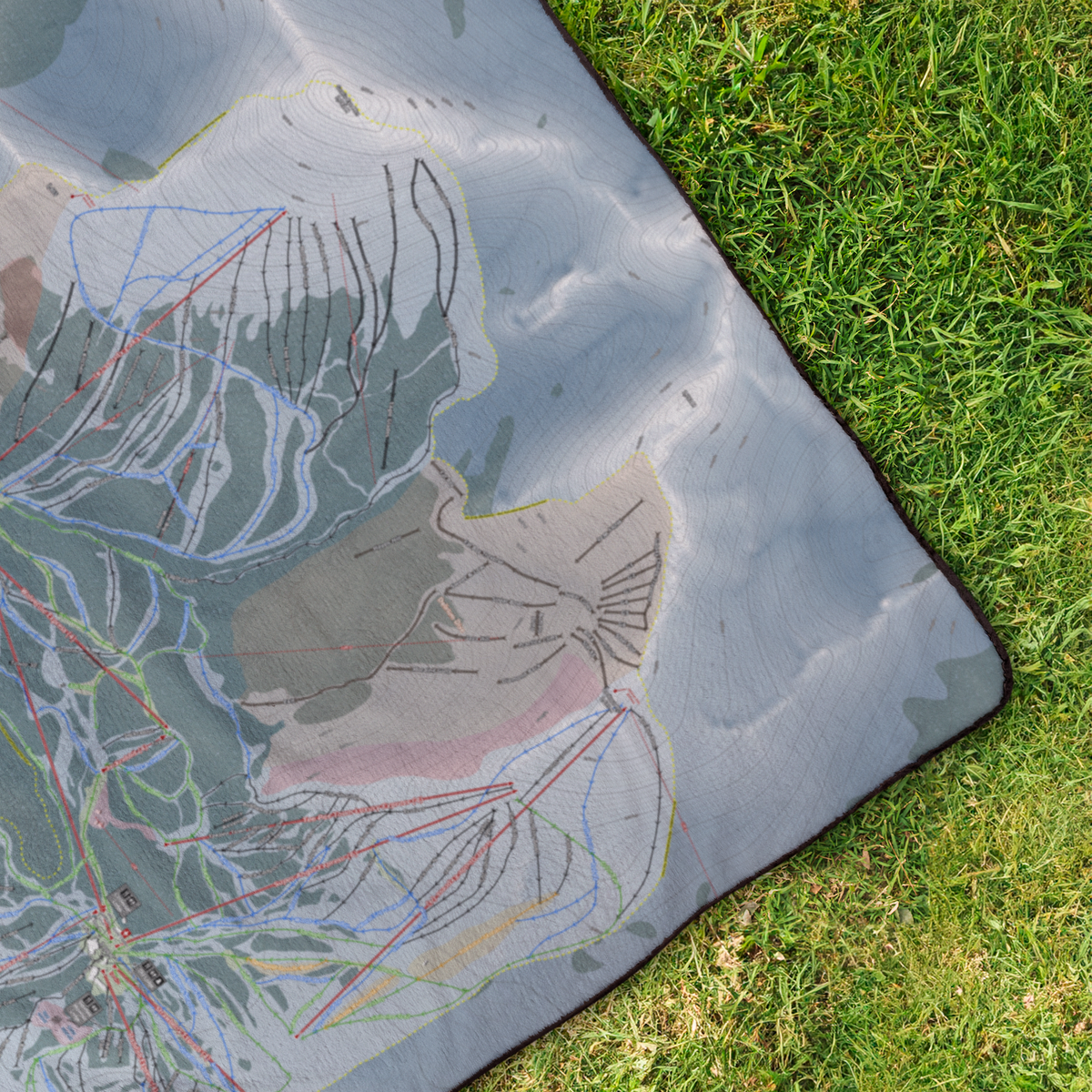 BanffSunshine_StadiumBlanket_OverheadGrass_V_Mockup.png