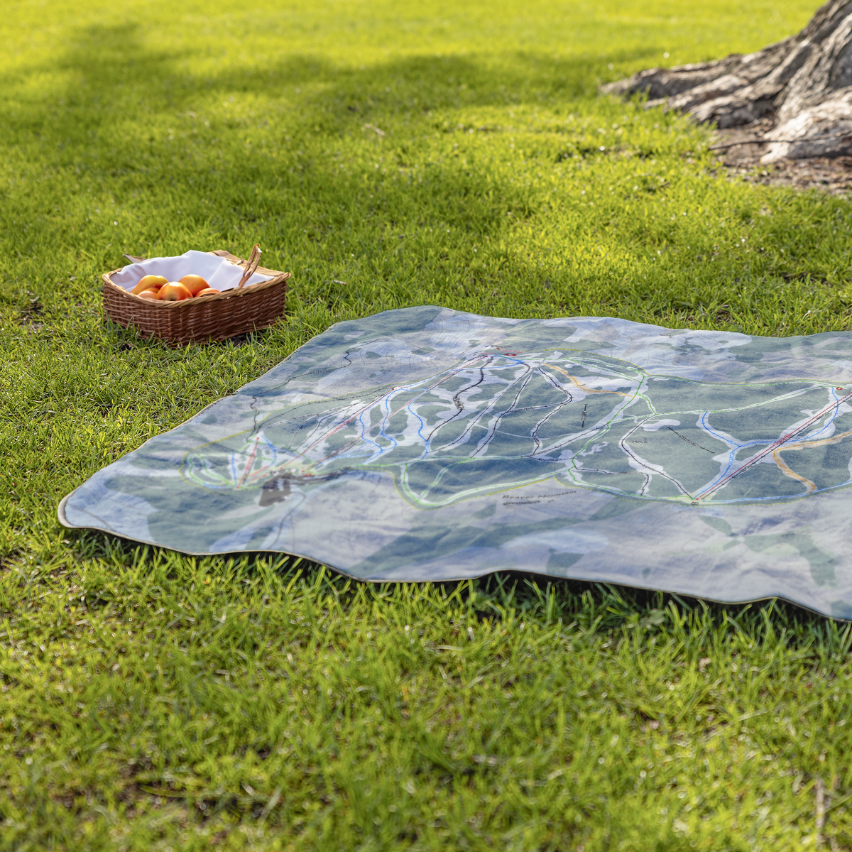 BeaverMountain_StadiumBlanket_Lifestyle_Grass_V_AS_Mockup.png
