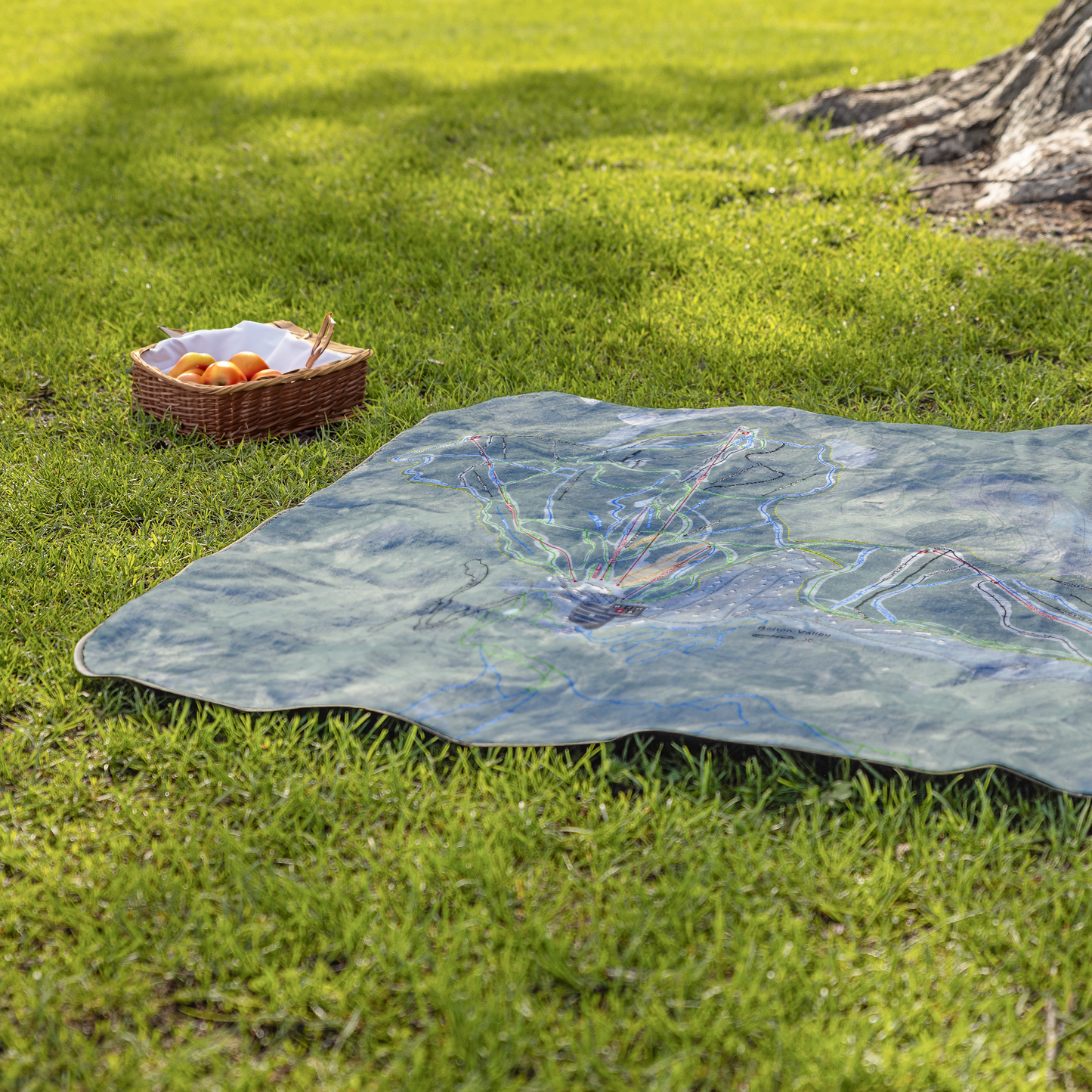 BoltonValley_StadiumBlanket_Lifestyle_Grass_V_AS_Mockup.png