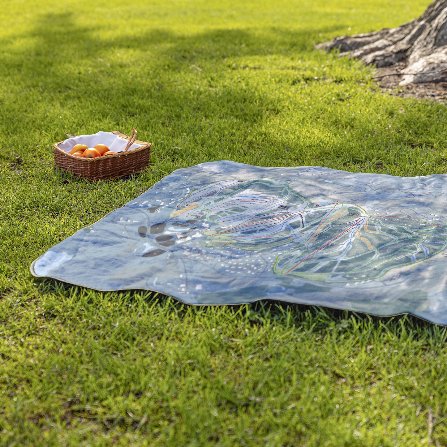 Boyne_Mountain_StadiumBlanket_Lifestyle_Grass_V_AS_Mockup.png