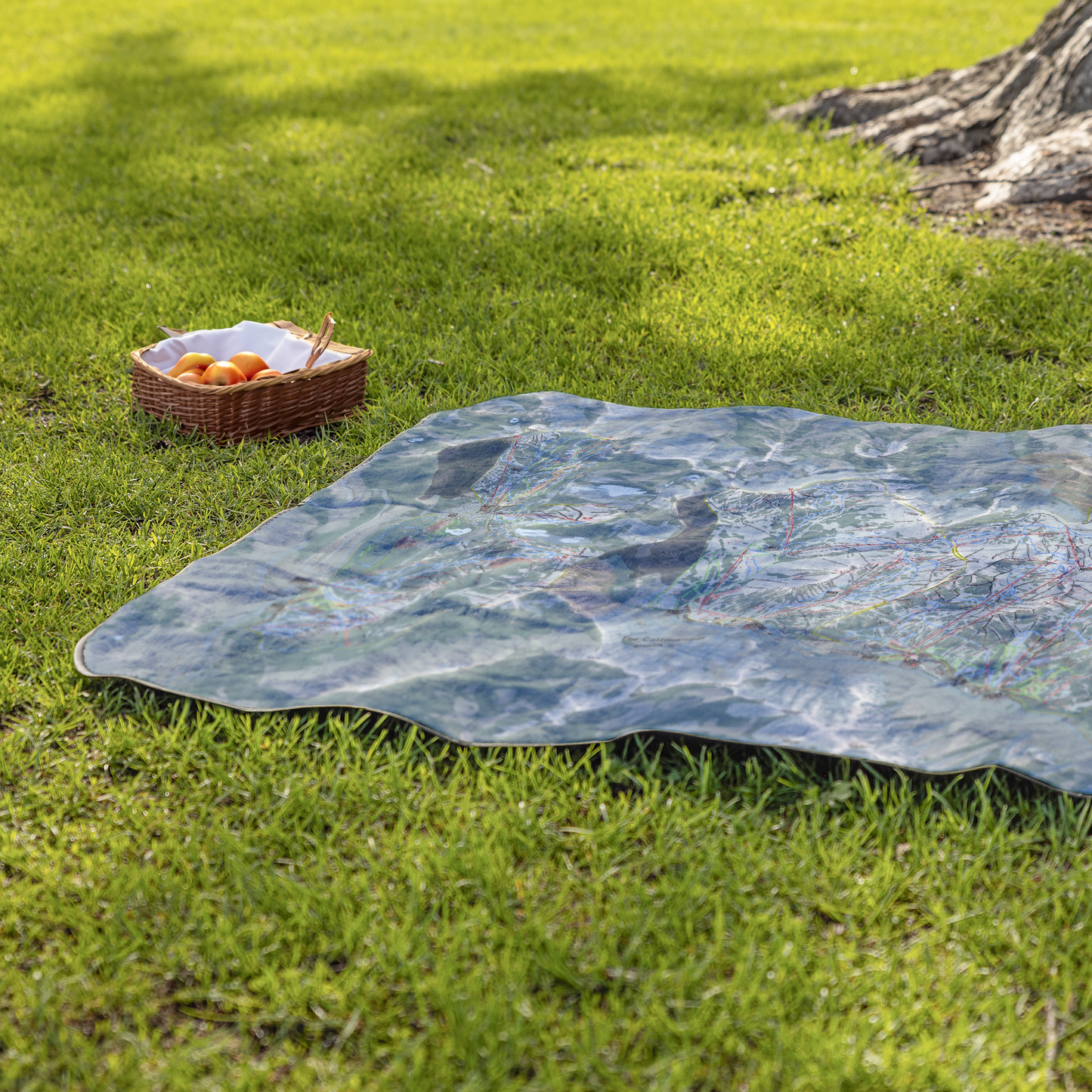 Cottonwoods_StadiumBlanket_Lifestyle_Grass_V_AS_Mockup.png