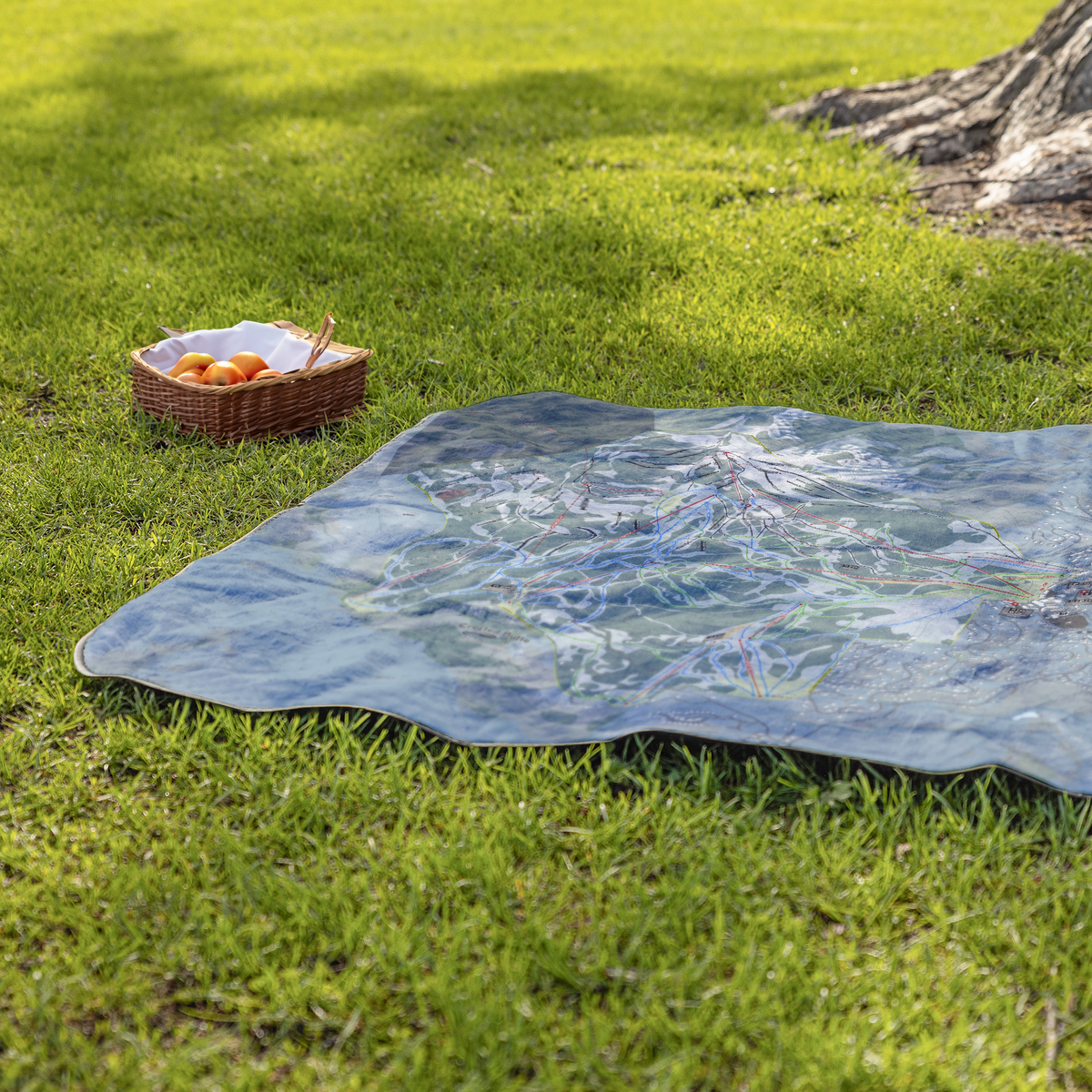 CrestedButte_StadiumBlanket_Lifestyle_Grass_V_AS_Mockup.png