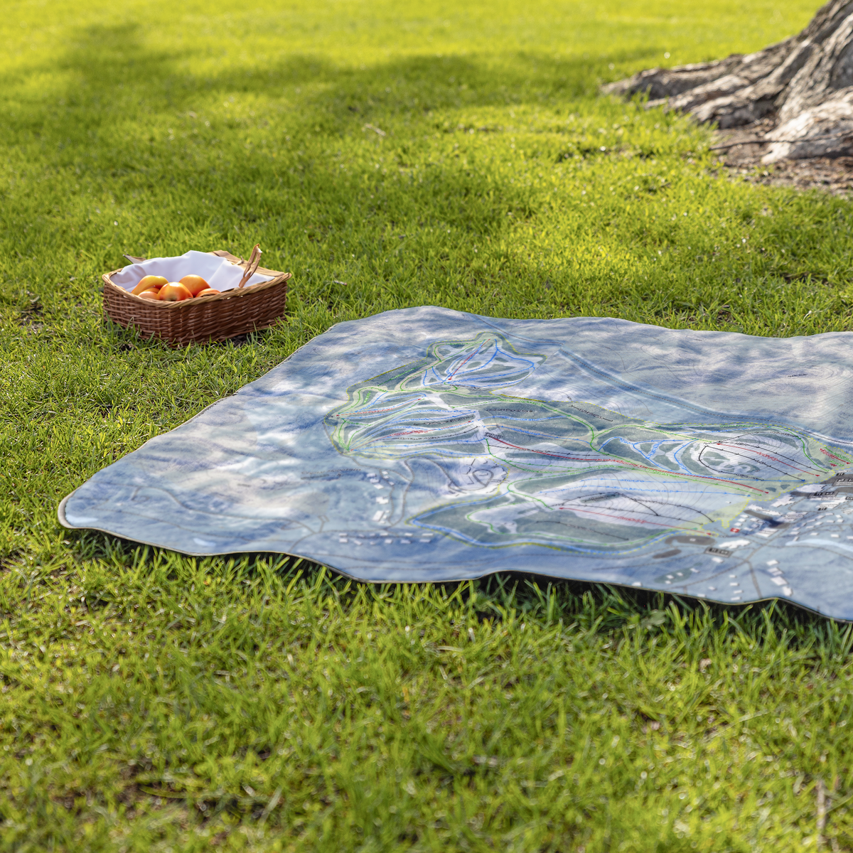 Crystal_Mountain_StadiumBlanket_Lifestyle_Grass_V_AS_Mockup.png