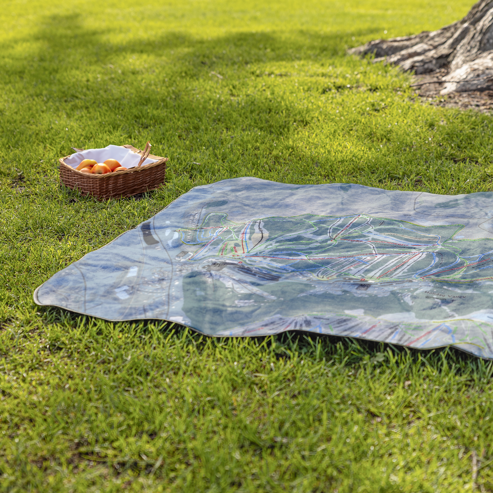 Holiday_Valley_StadiumBlanket_Lifestyle_Grass_V_AS_Mockup.png