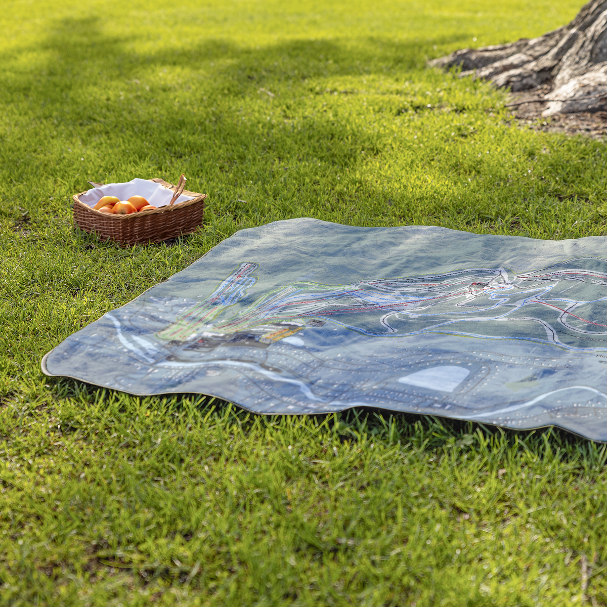 Hunter_Mountain_StadiumBlanket_Lifestyle_Grass_V_AS_Mockup.png