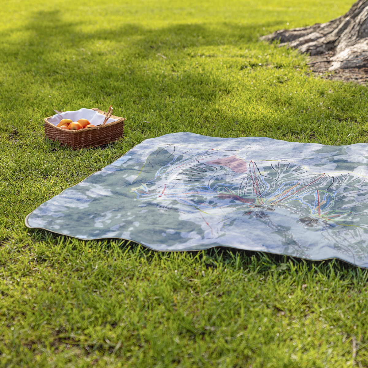 Kirkwood_StadiumBlanket_Lifestyle_Grass_V_AS_Mockup.png