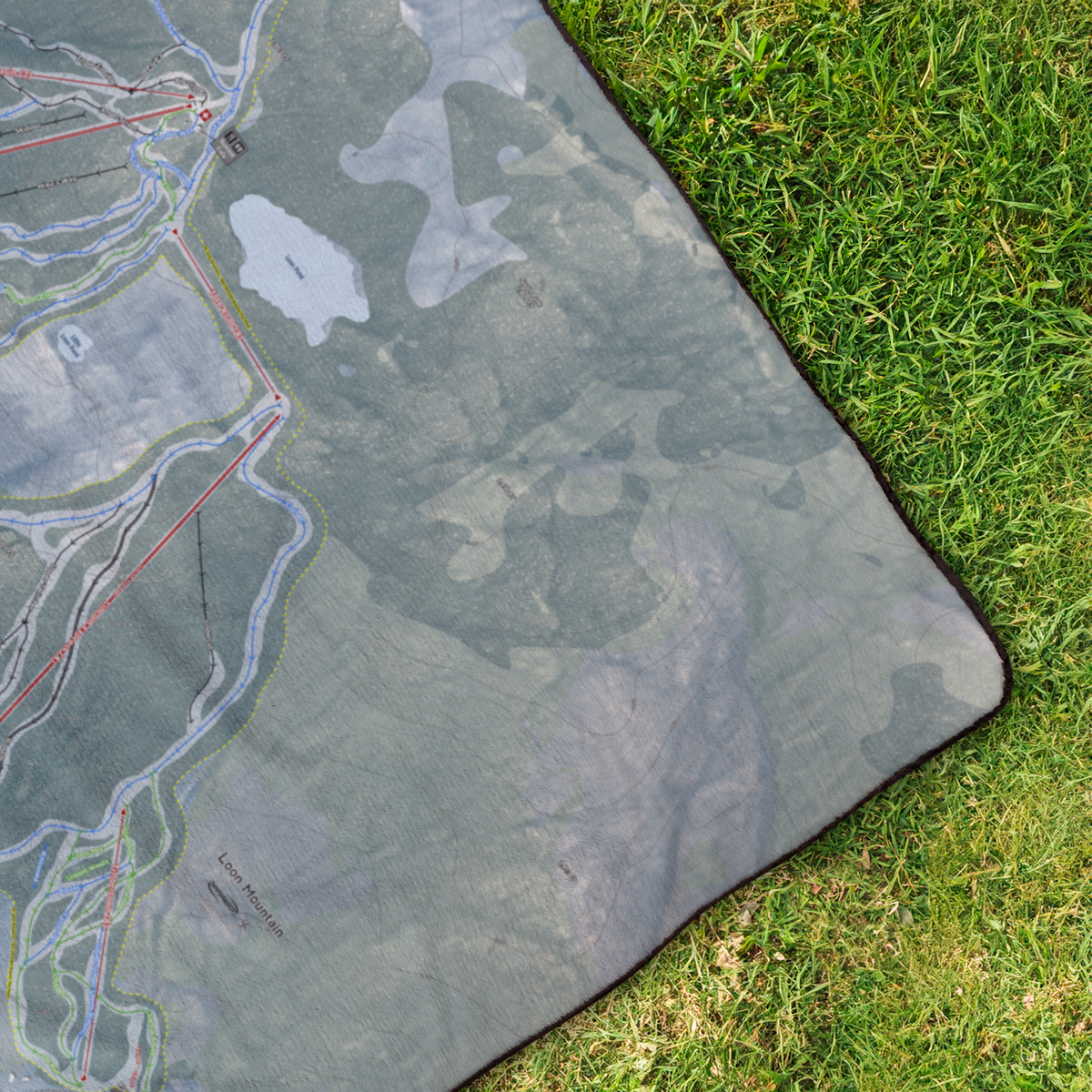 LoonMountain_StadiumBlanket_OverheadGrass_V_Mockup.png