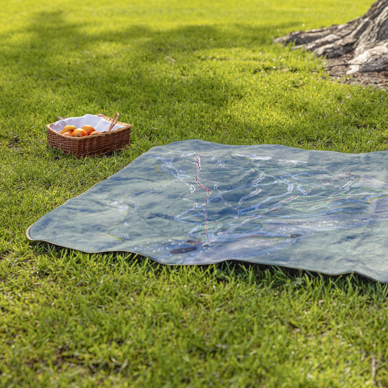 Mad_River_Glen_StadiumBlanket_Lifestyle_Grass_V_AS_Mockup.png