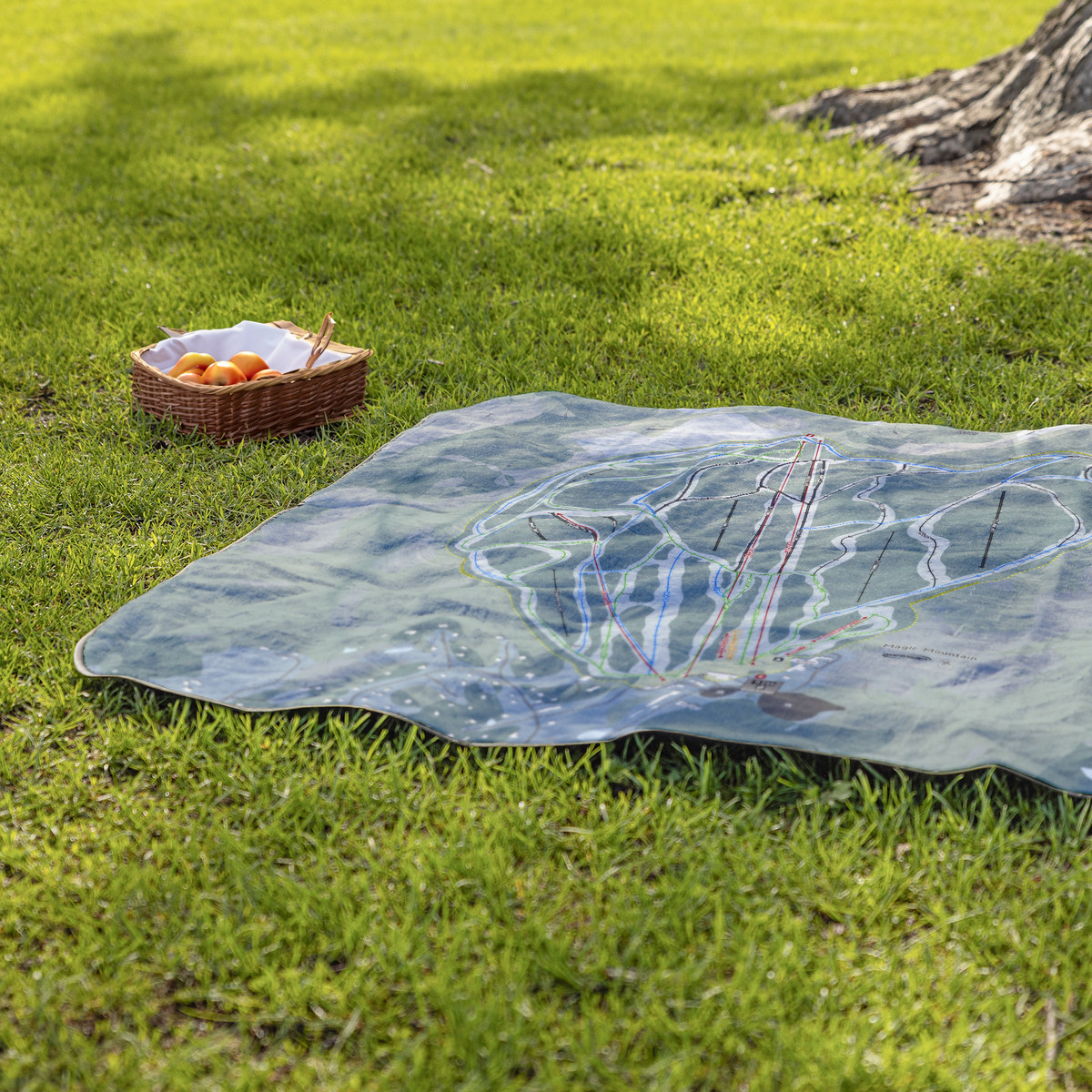 MagicMountain_StadiumBlanket_Lifestyle_Grass_V_AS_Mockup.png