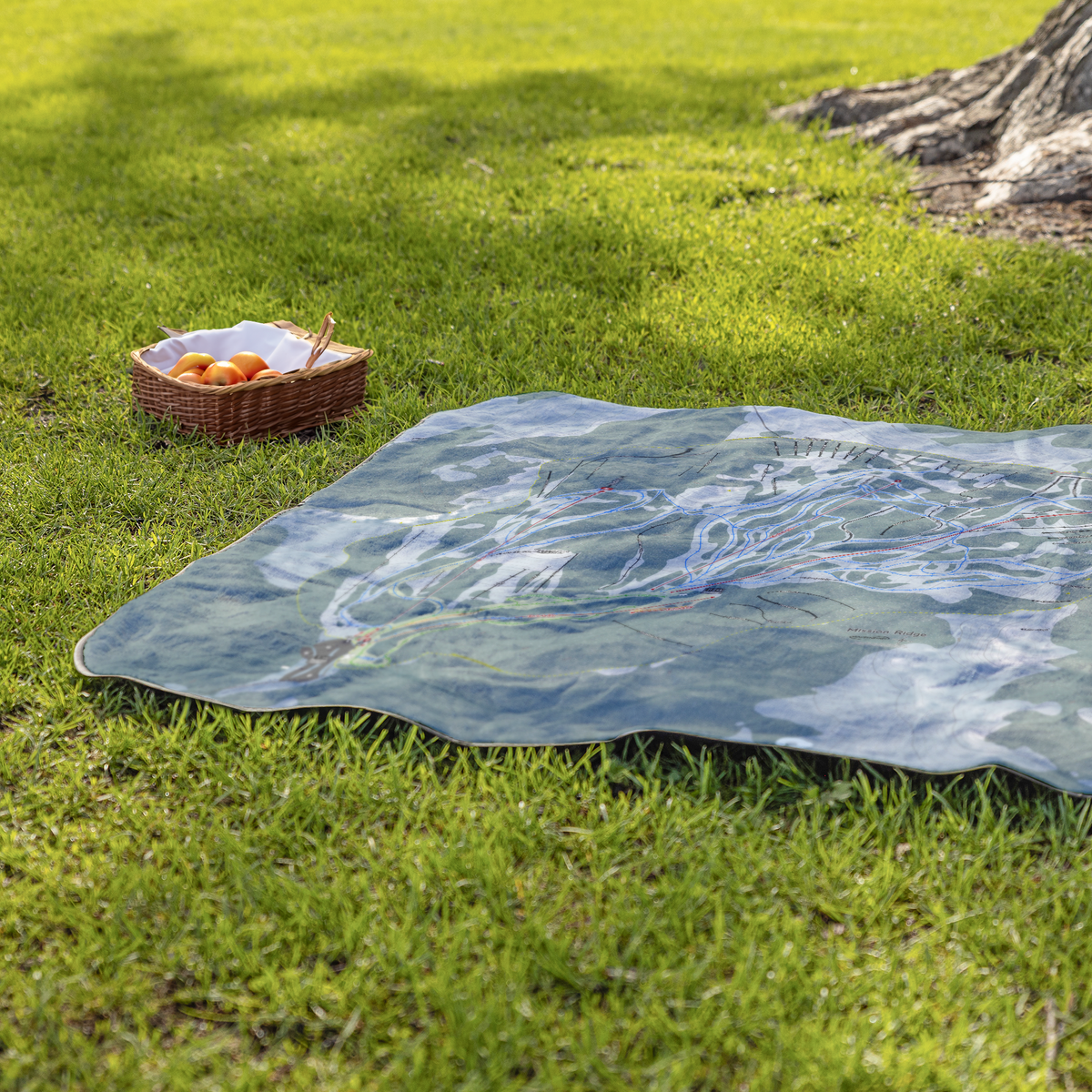 Mission_Ridge_StadiumBlanket_Lifestyle_Grass_V_AS_Mockup.png