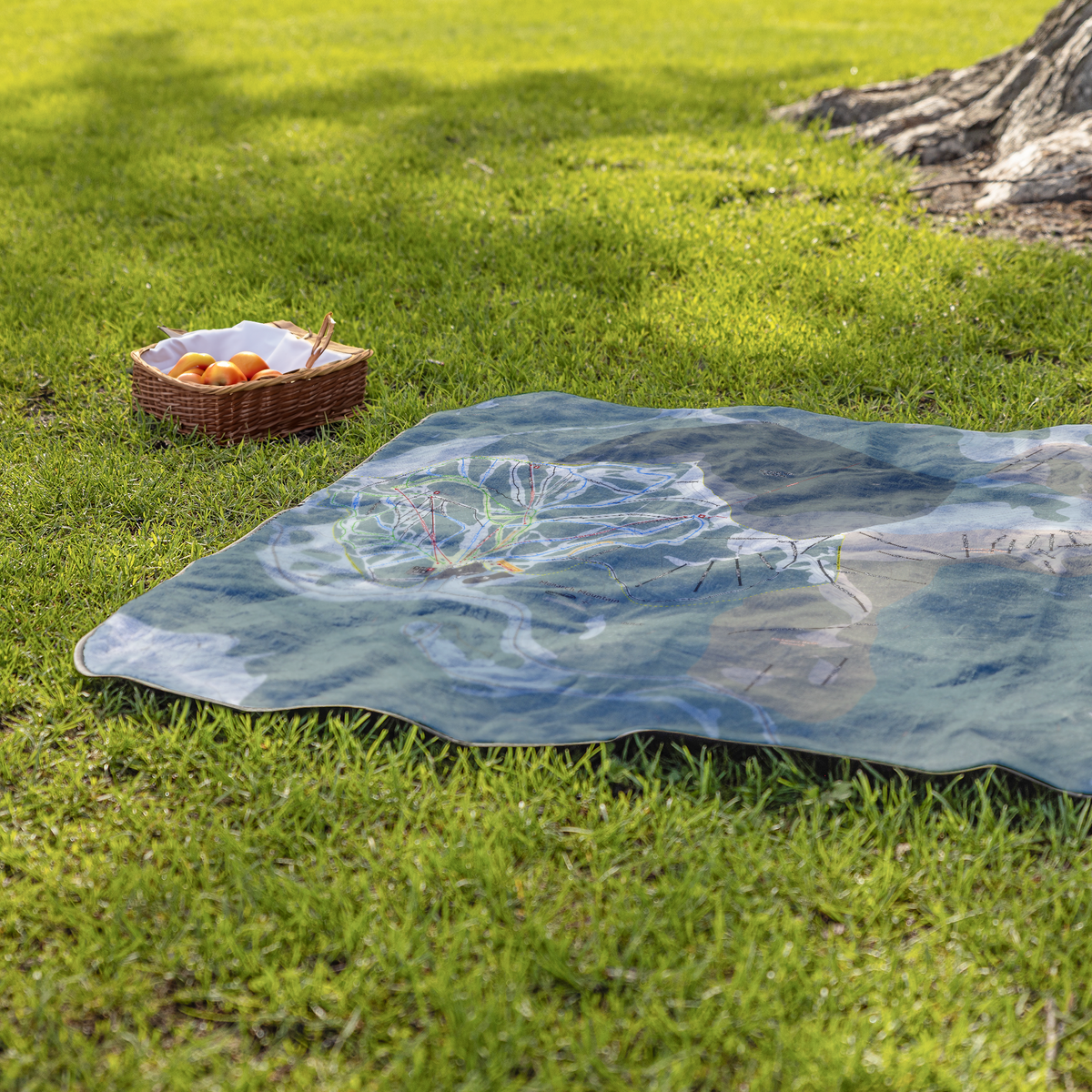 MonarchMountain_StadiumBlanket_Lifestyle_Grass_V_AS_Mockup.png