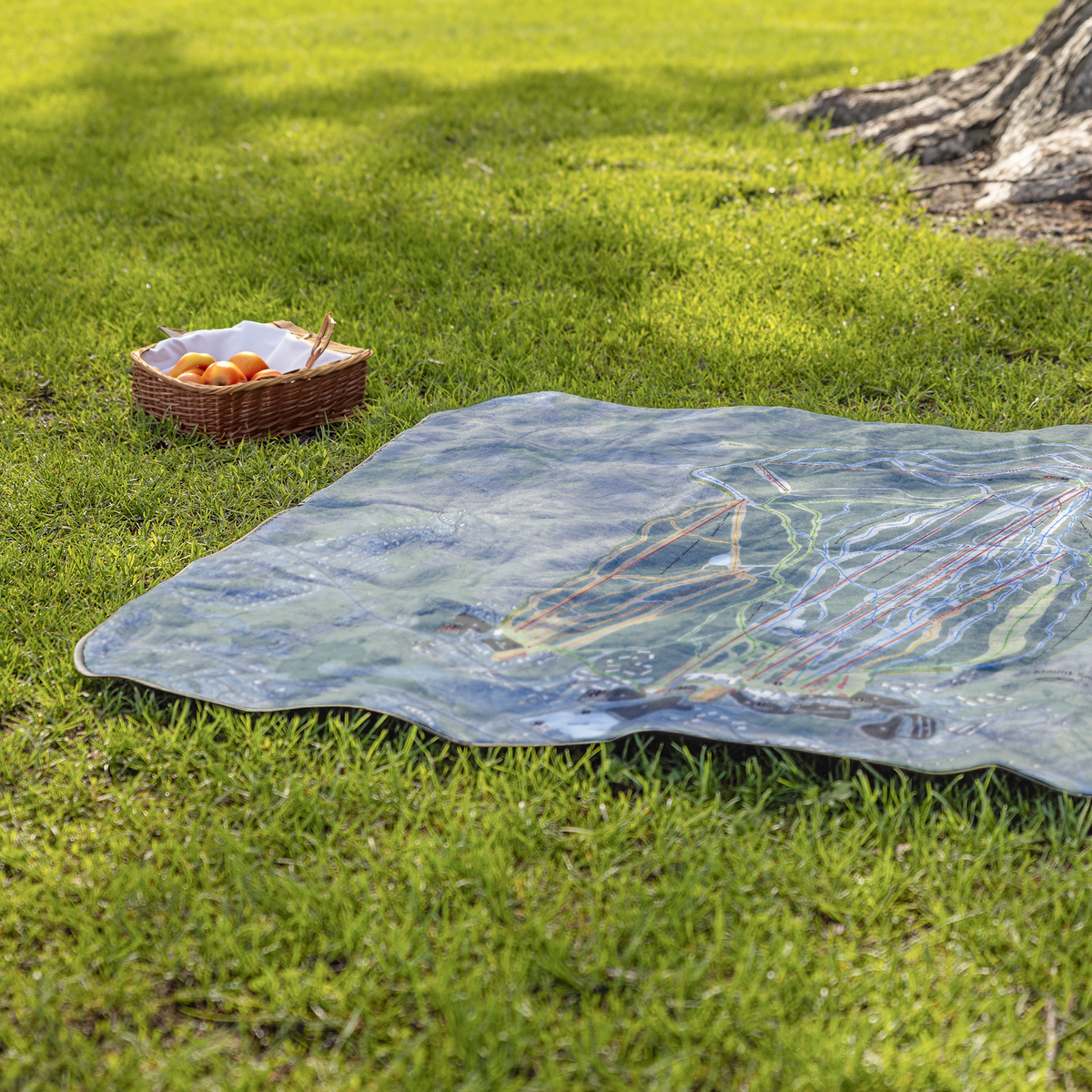 MountSnow_StadiumBlanket_Lifestyle_Grass_V_AS_Mockup.png