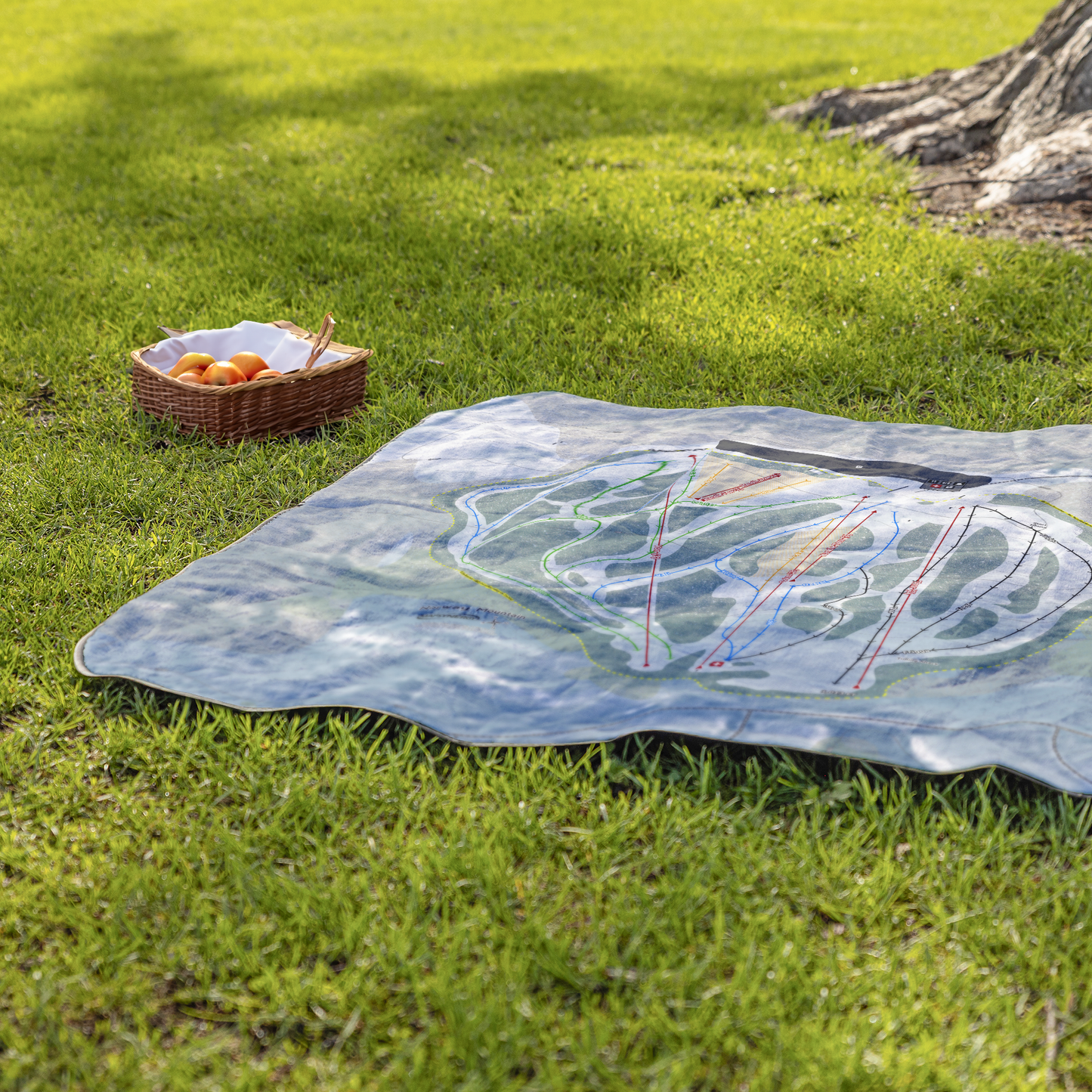 Norway_Mountain_StadiumBlanket_Lifestyle_Grass_V_AS_Mockup.png