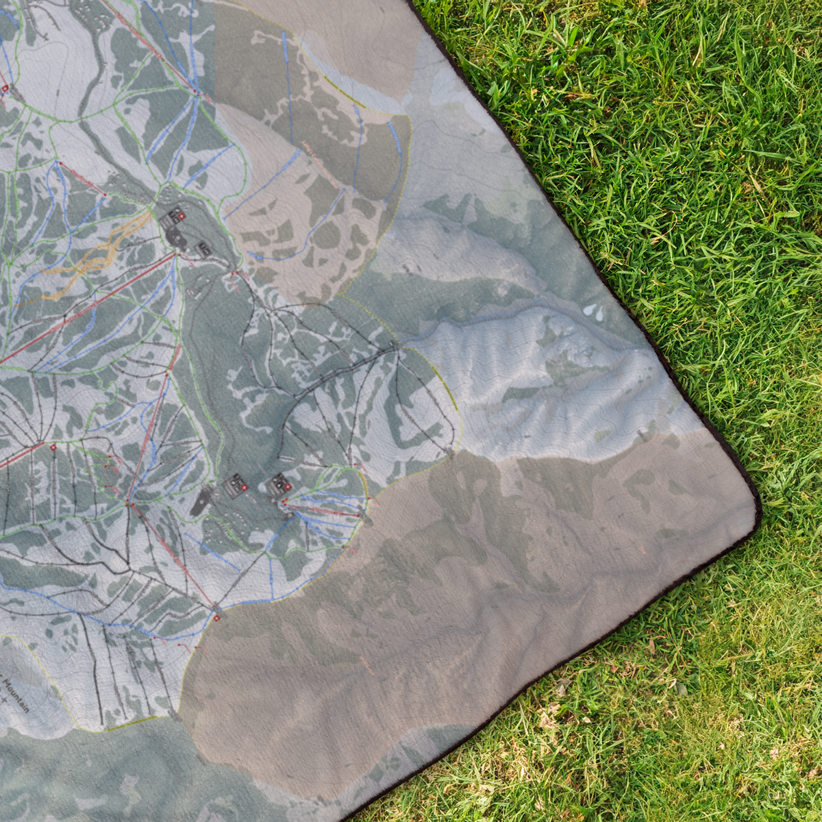 PowderMountain_StadiumBlanket_OverheadGrass_V_Mockup.png