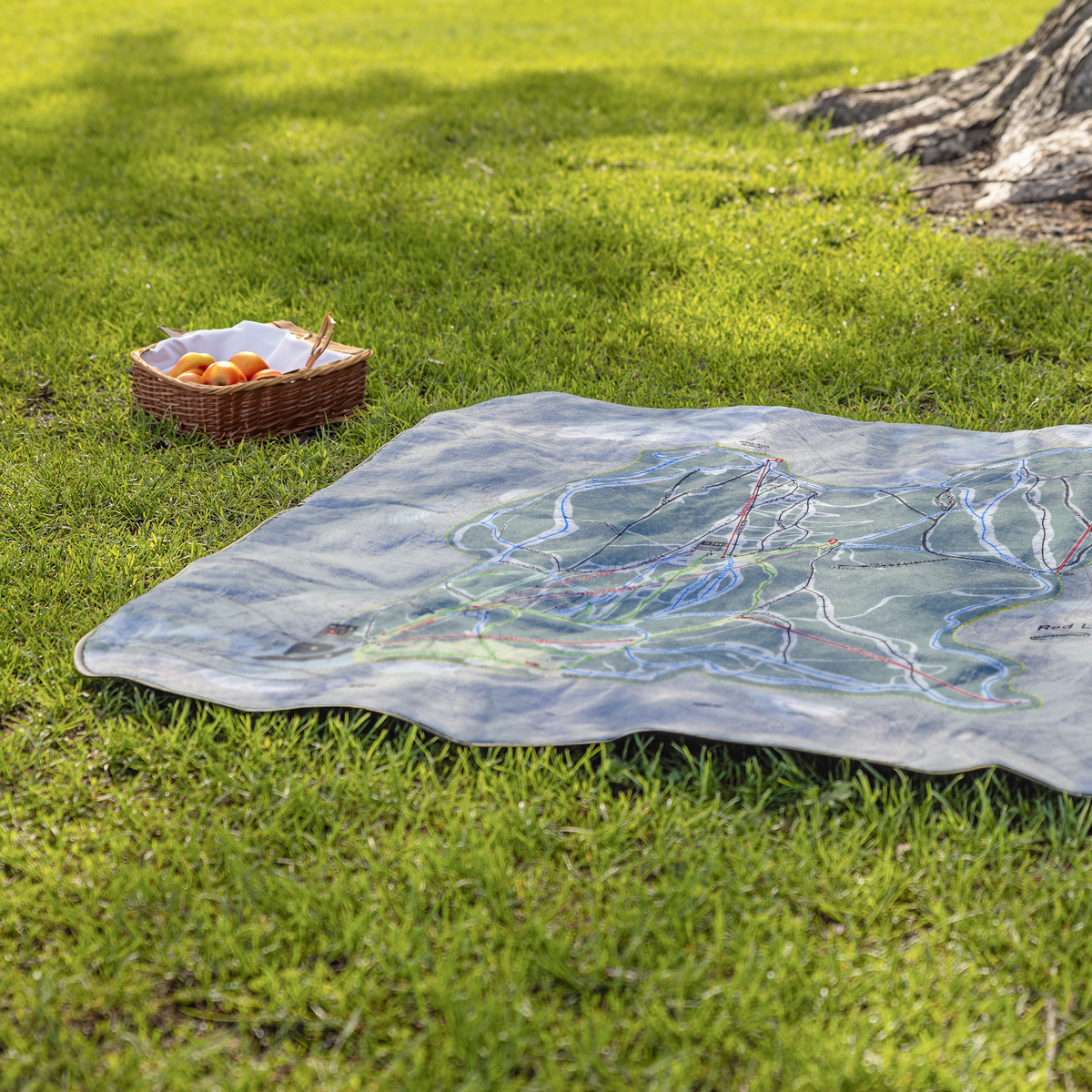 Red_Lodge_StadiumBlanket_Lifestyle_Grass_V_AS_Mockup.png