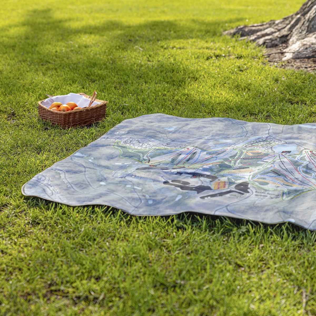 Seven_Springs_StadiumBlanket_Lifestyle_Grass_V_AS_Mockup.png