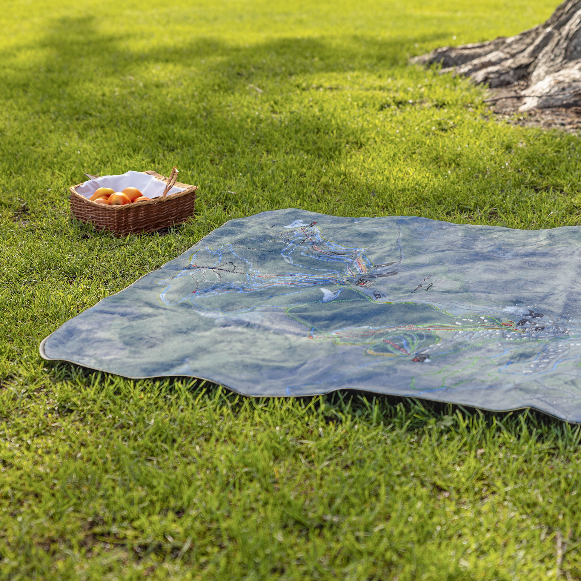 Smugglers_Notch_StadiumBlanket_Lifestyle_Grass_V_AS_Mockup.png
