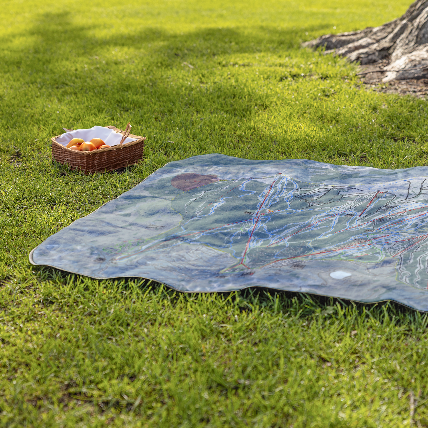 Snowmass_StadiumBlanket_Lifestyle_Grass_V_AS_Mockup.png