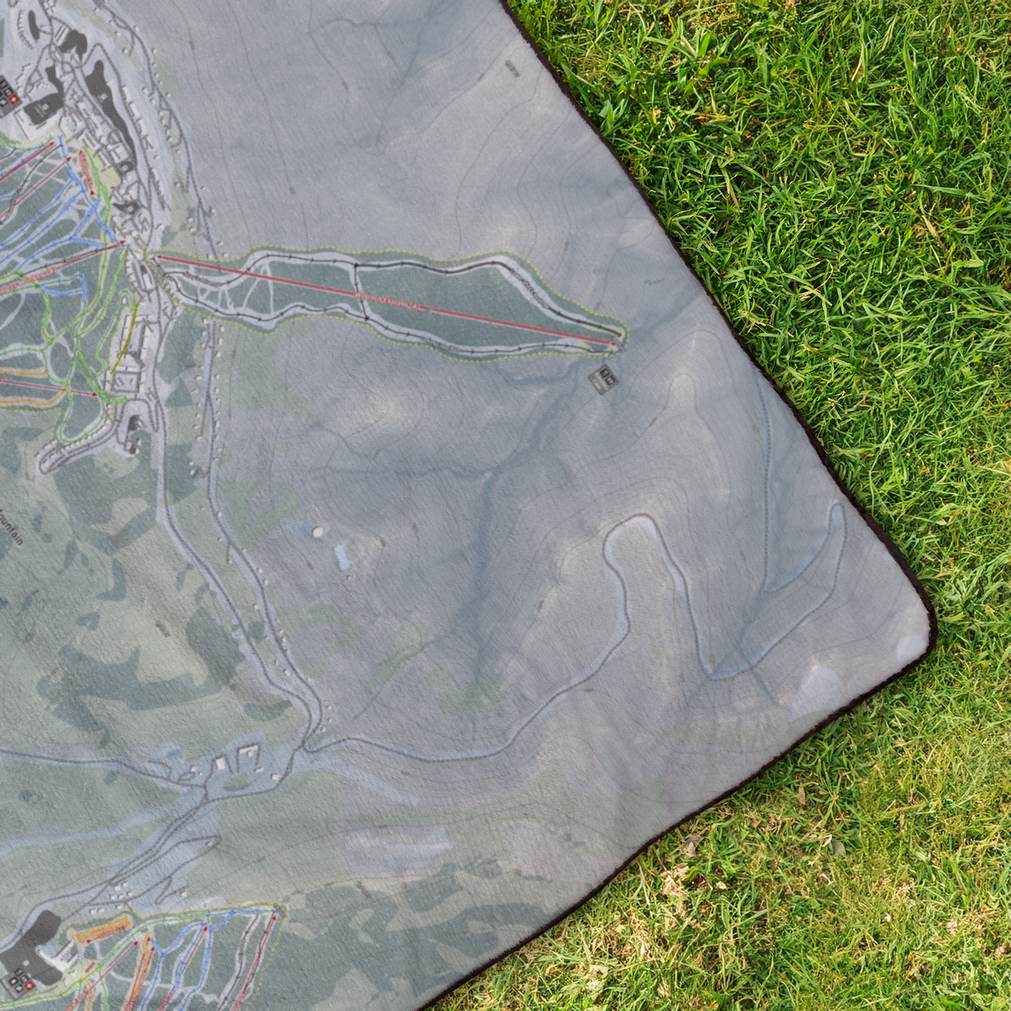 Snowshoe_Mountain_StadiumBlanket_OverheadGrass_V_Mockup.png