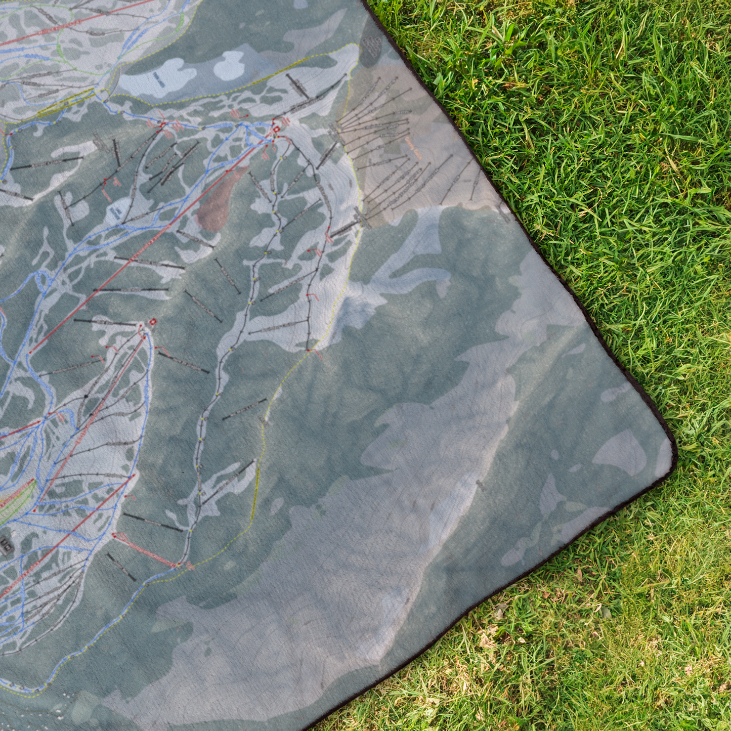 Solitude_StadiumBlanket_OverheadGrass_V_Mockup.png
