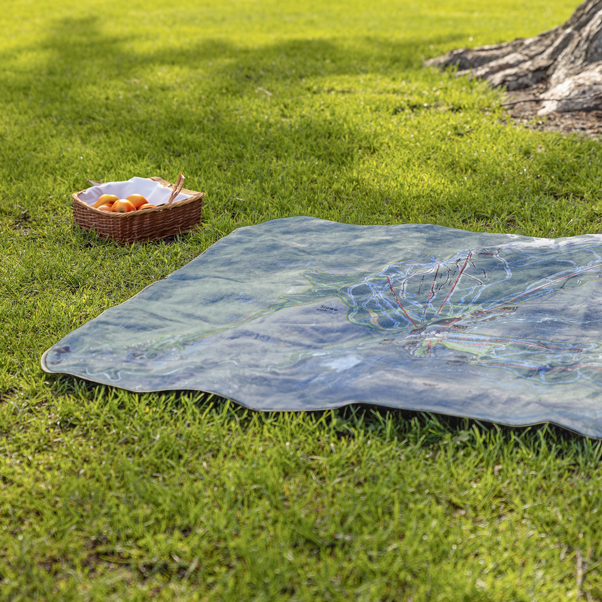 Stowe_StadiumBlanket_Lifestyle_Grass_V_AS_Mockup.png