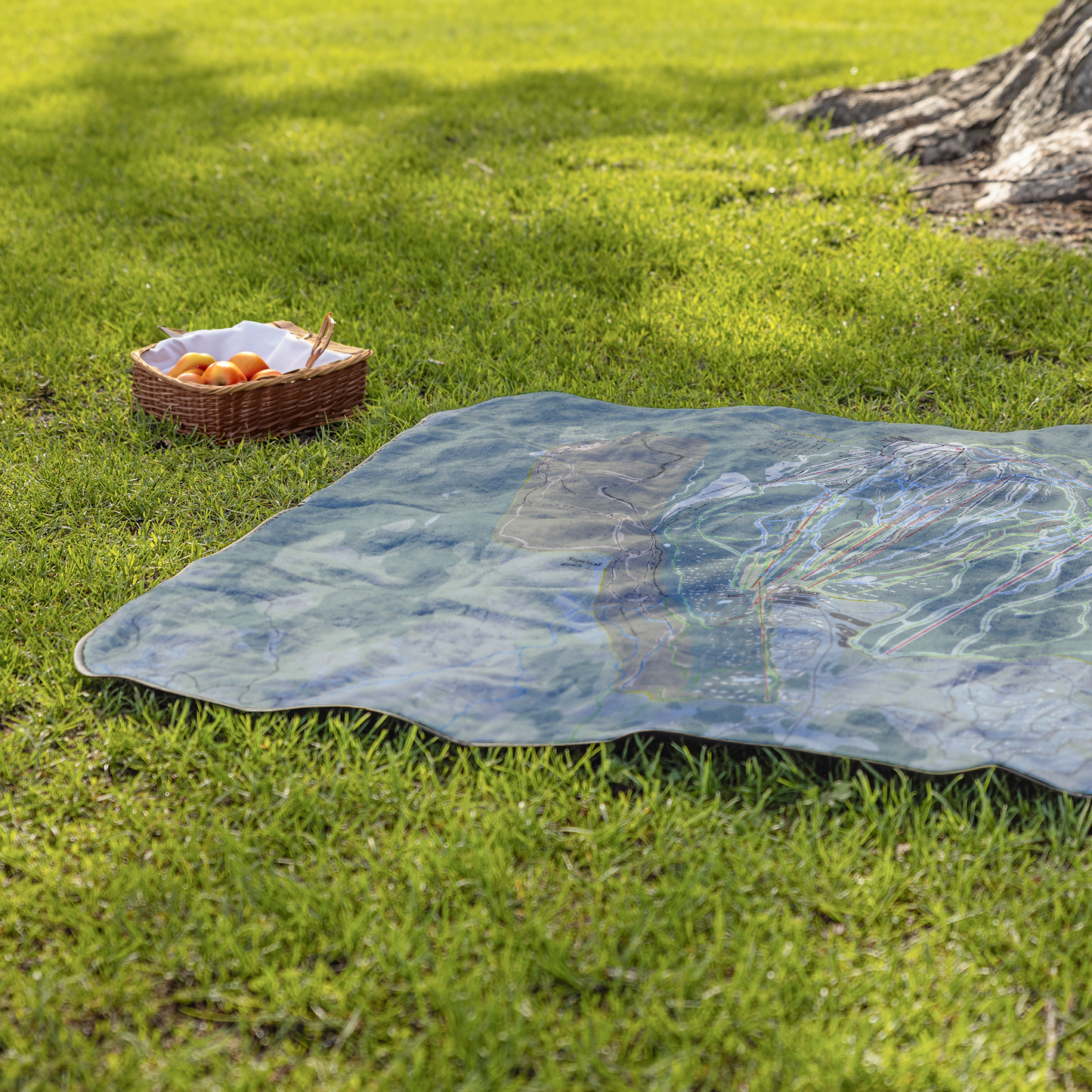 Sugarloaf_StadiumBlanket_Lifestyle_Grass_V_AS_Mockup.png