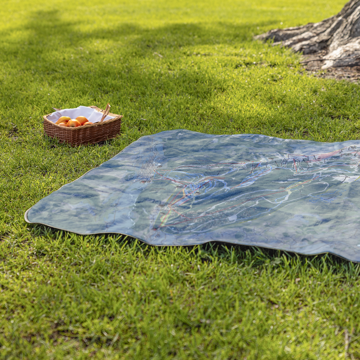 Telluride_StadiumBlanket_Lifestyle_Grass_V_AS_Mockup.png
