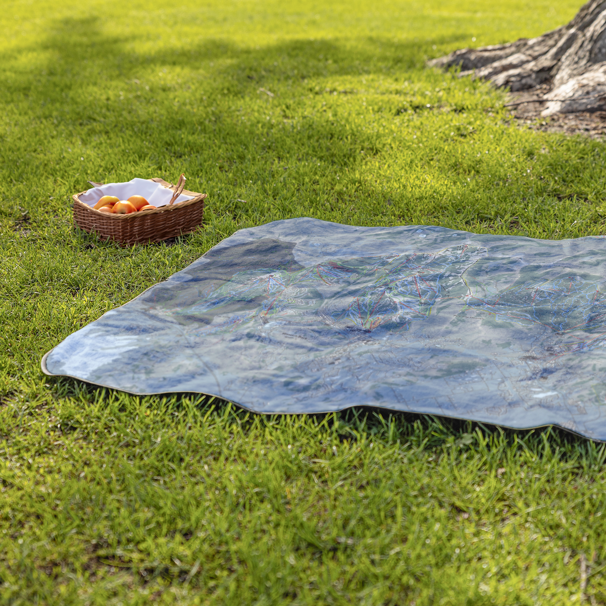 WasatchBack_StadiumBlanket_Lifestyle_Grass_V_AS_Mockup.png