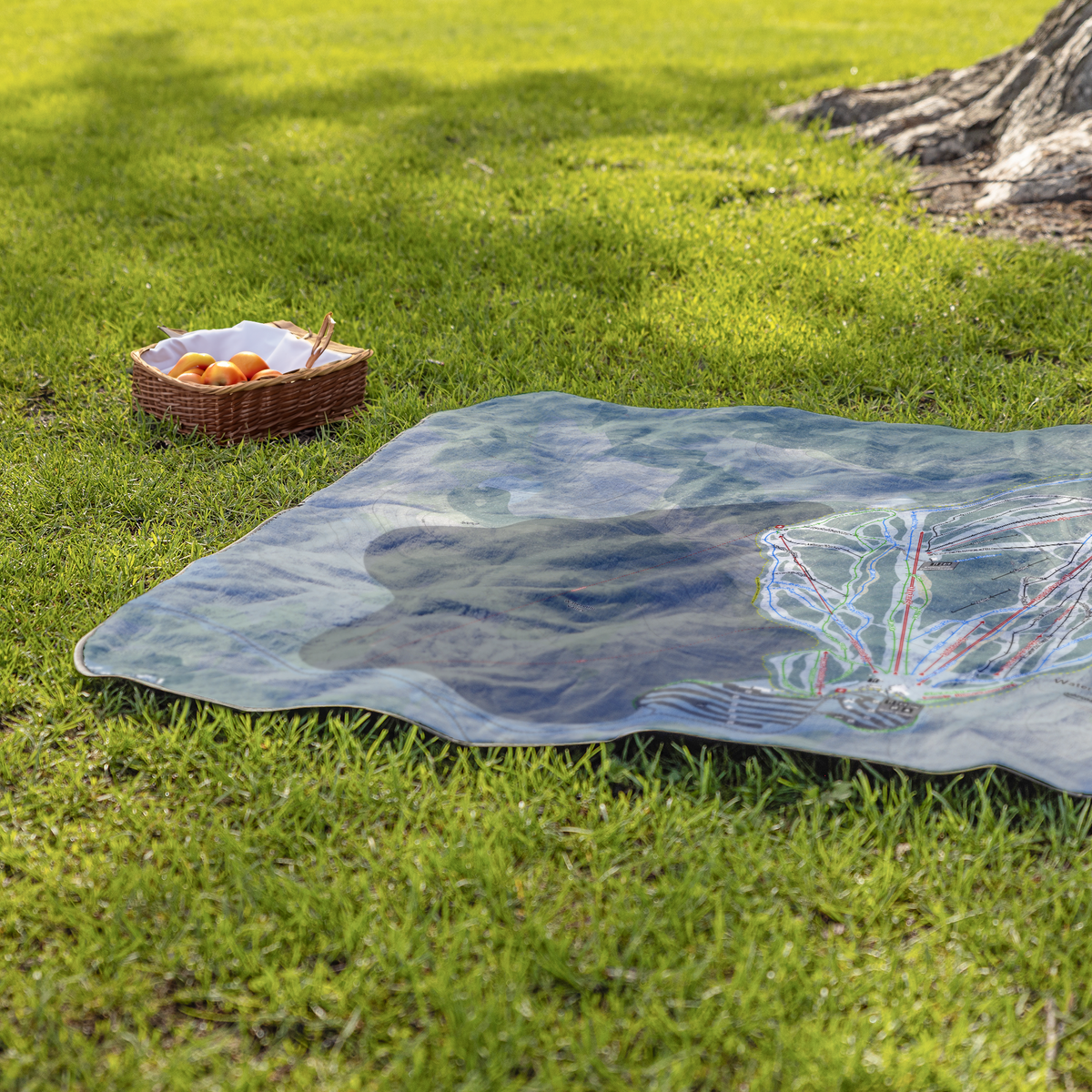 WatervilleValley_StadiumBlanket_Lifestyle_Grass_V_AS_Mockup.png