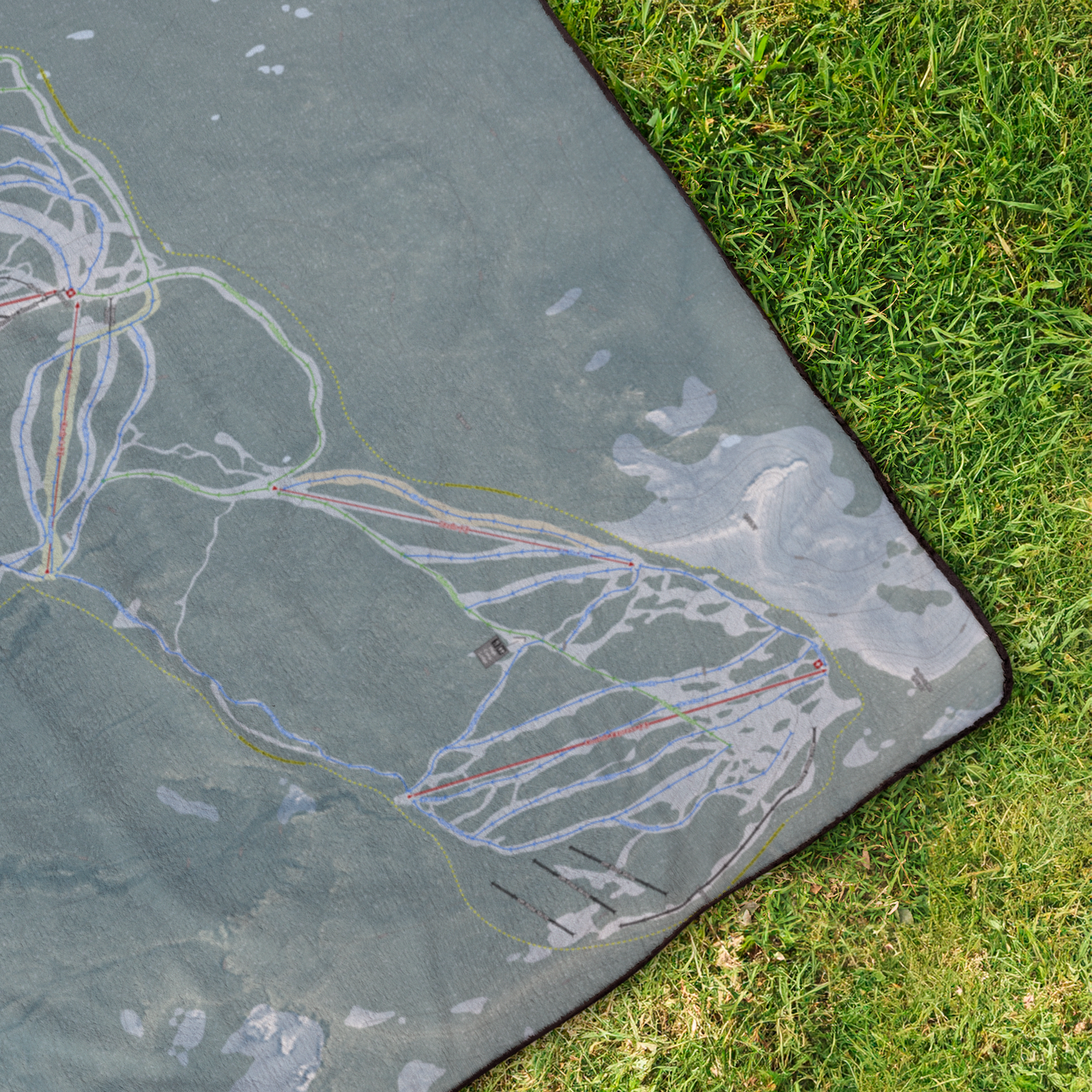 White_Pass_StadiumBlanket_OverheadGrass_V_Mockup.png