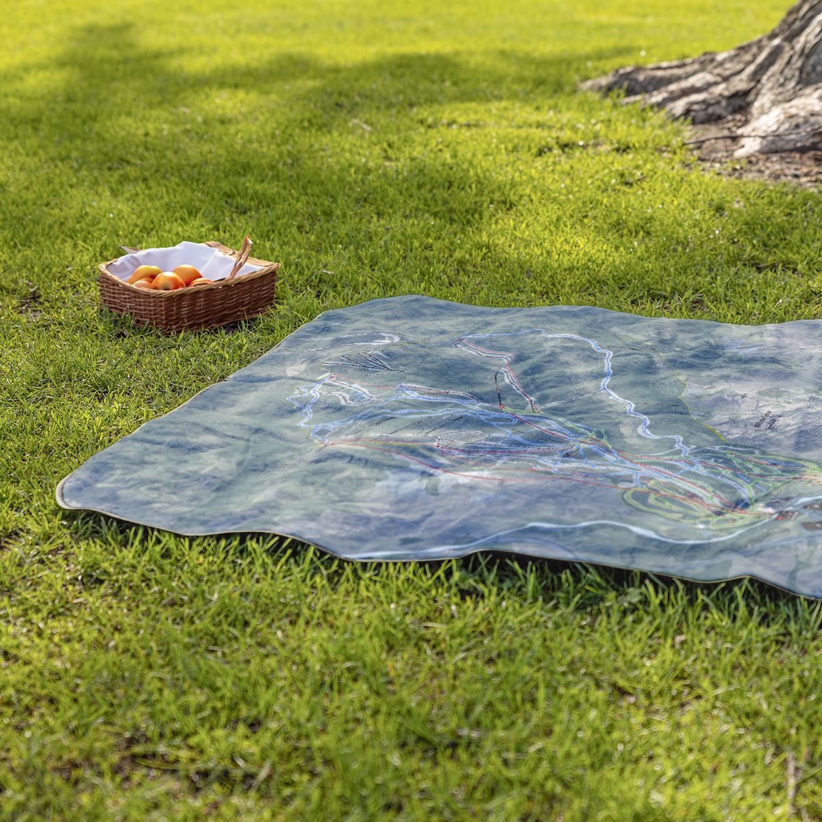 Whiteface_Mountain_StadiumBlanket_Lifestyle_Grass_V_AS_Mockup.png