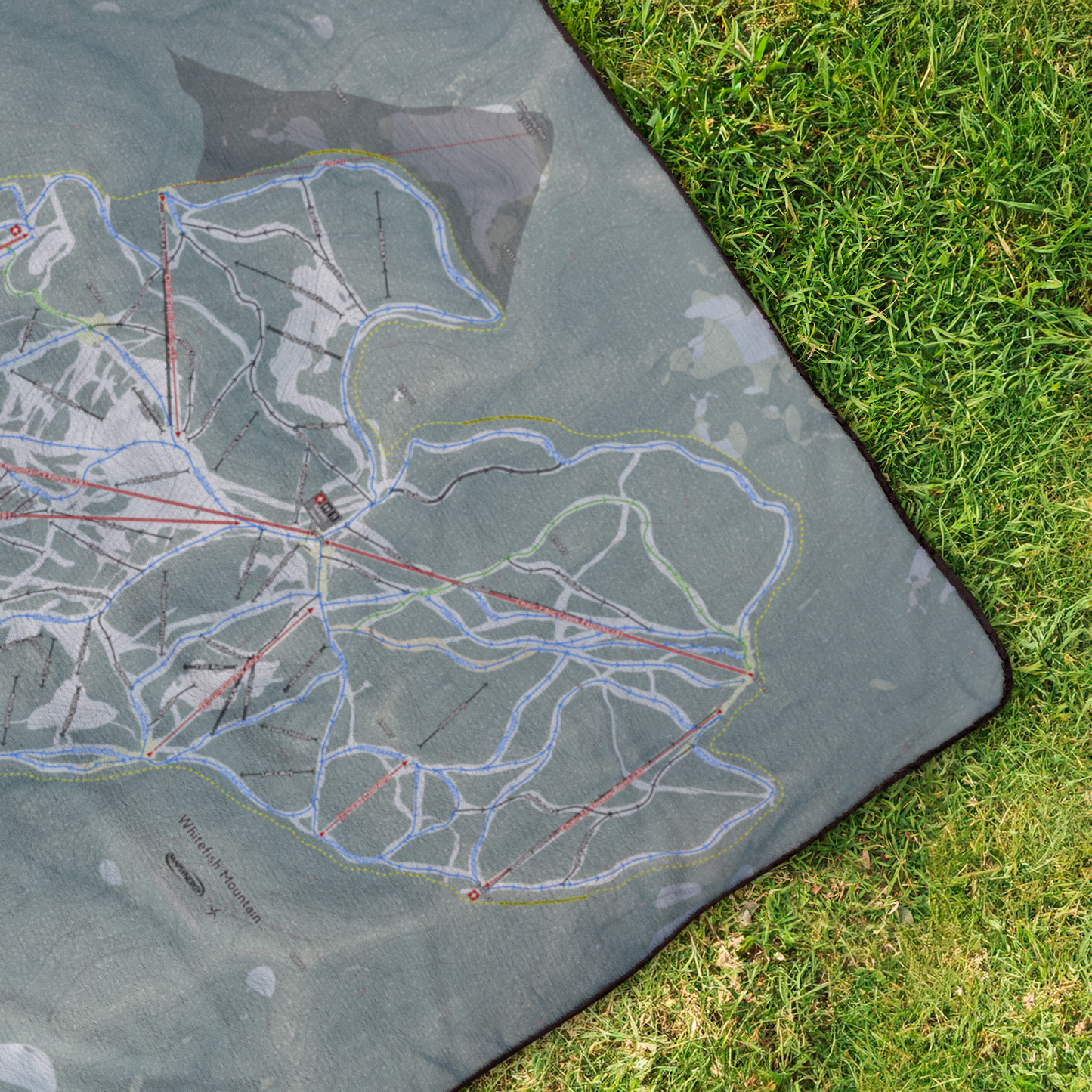 Whitefish_Mountain_StadiumBlanket_OverheadGrass_V_Mockup.png
