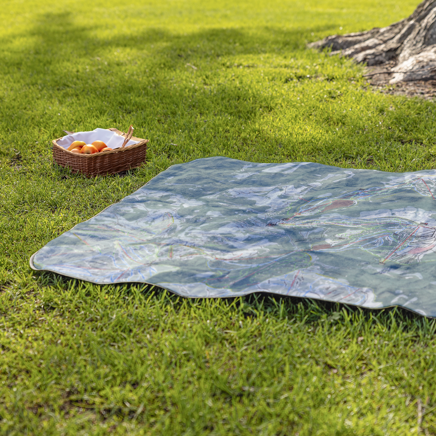 Yellowstone_Club_StadiumBlanket_Lifestyle_Grass_V_AS_Mockup.png