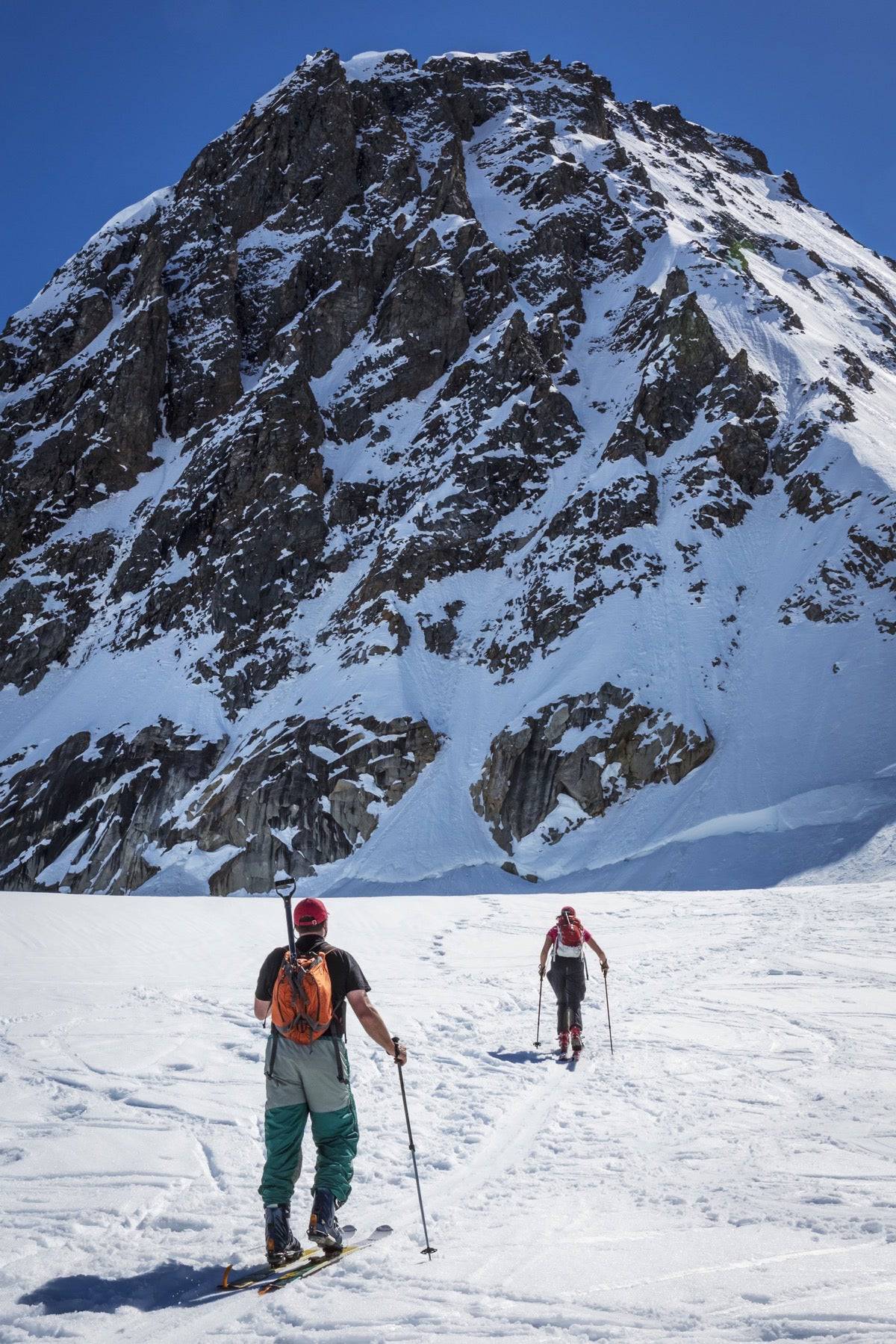 A couple telemark skiing on the Ruth Glacier - Powderaddicts