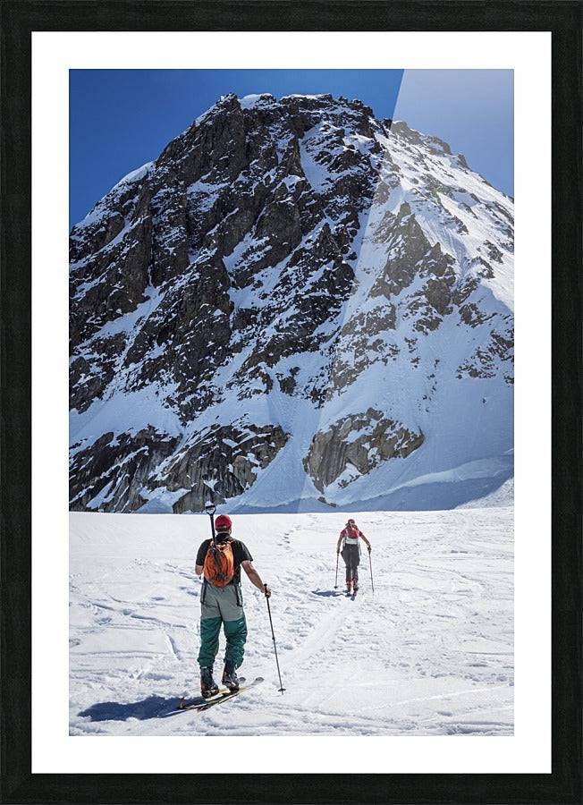 A couple telemark skiing on the Ruth Glacier - Powderaddicts