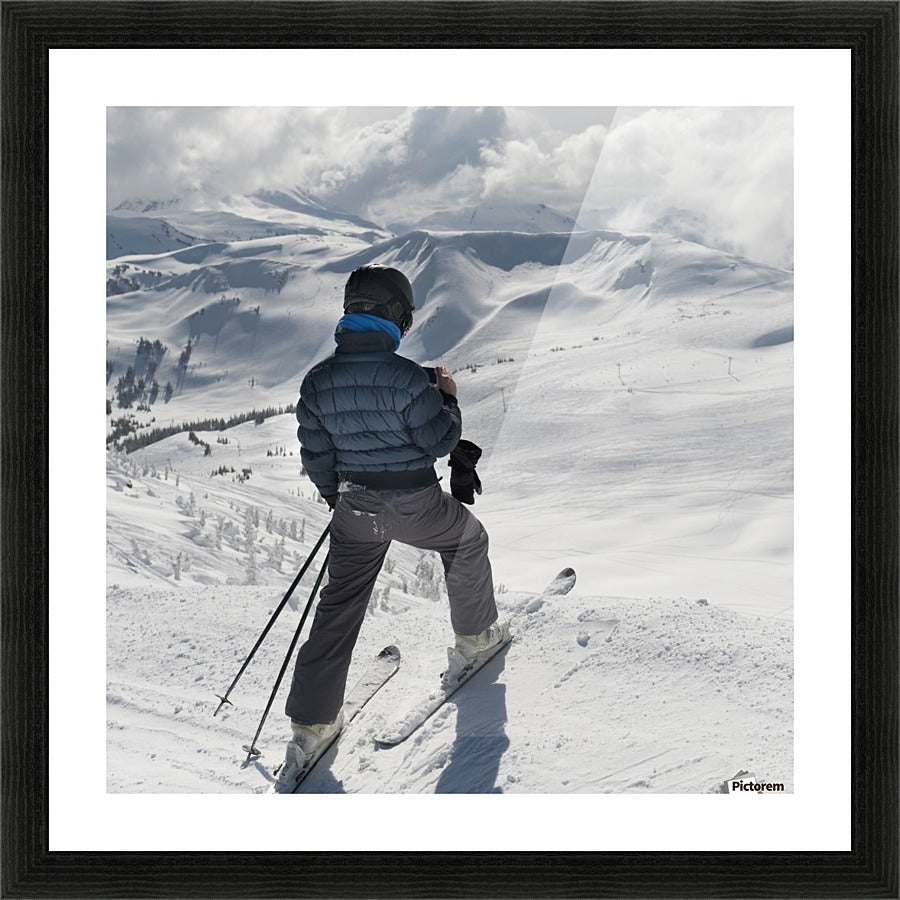 A Skier Pauses On The Trail To Look Out Over The Mountains; Whistler, British Columbia, Canada - Powderaddicts