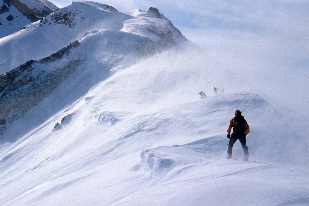 Back Country Skier Climbing Ridge - Powderaddicts
