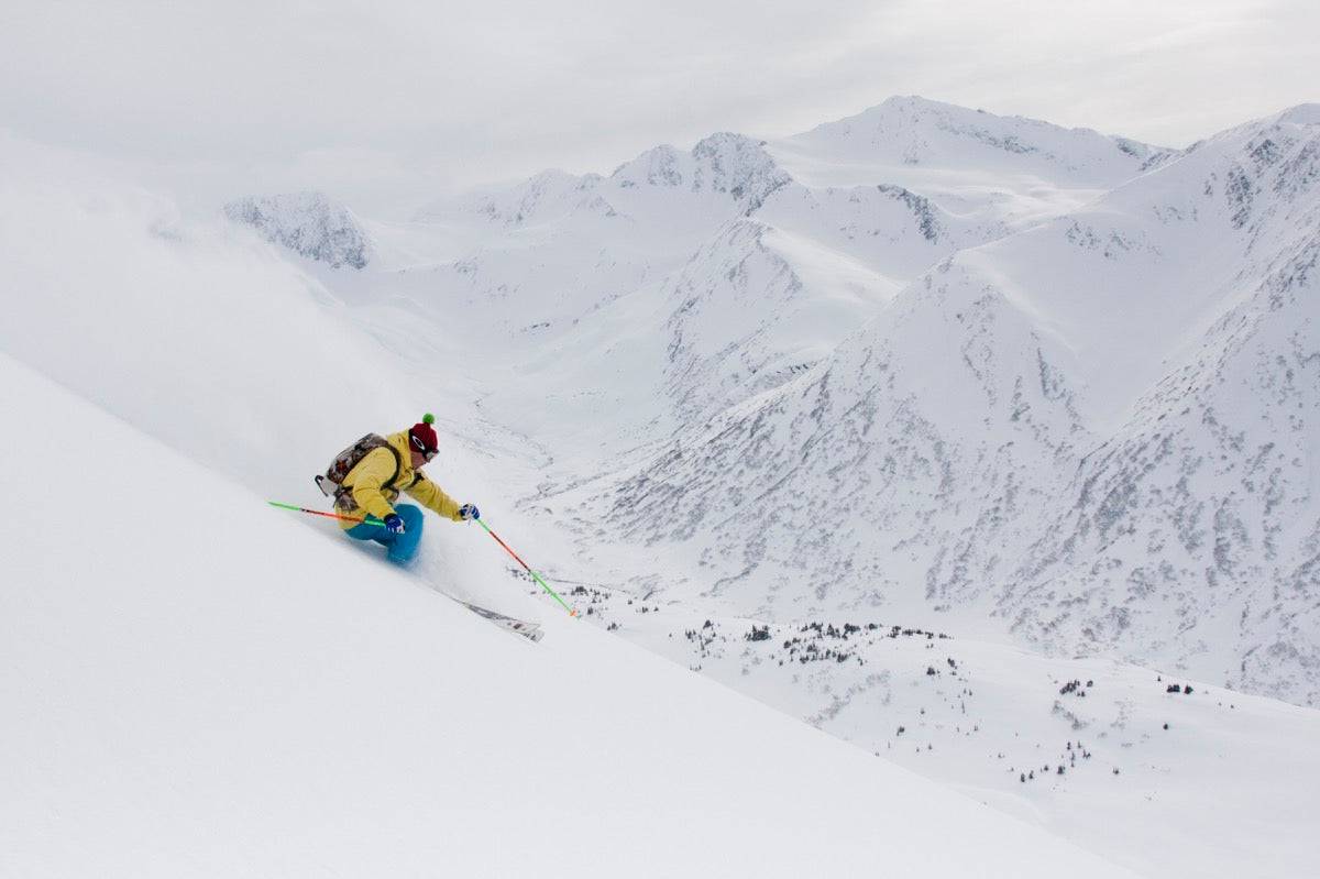 Downhill Skier In Fresh Powder - Powderaddicts