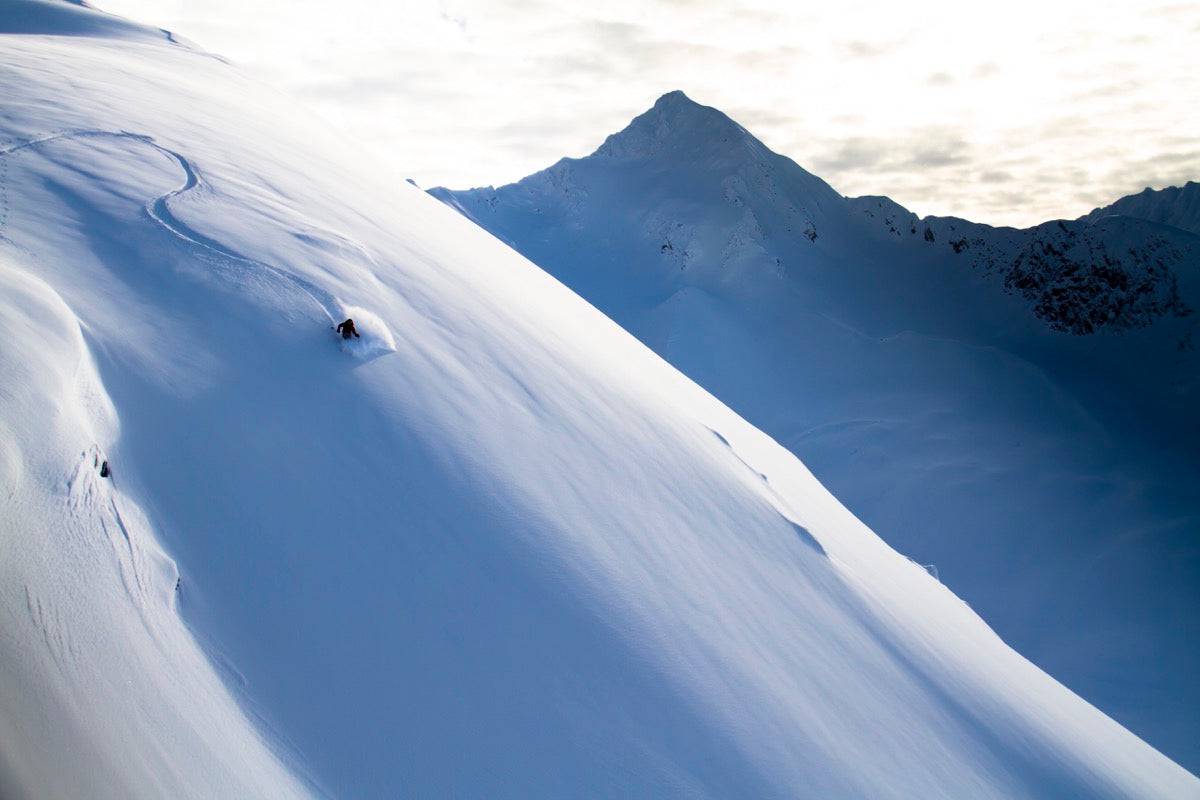 Man Backcountry Skiing In Powder Snow At Wolverine Bowl - Powderaddicts